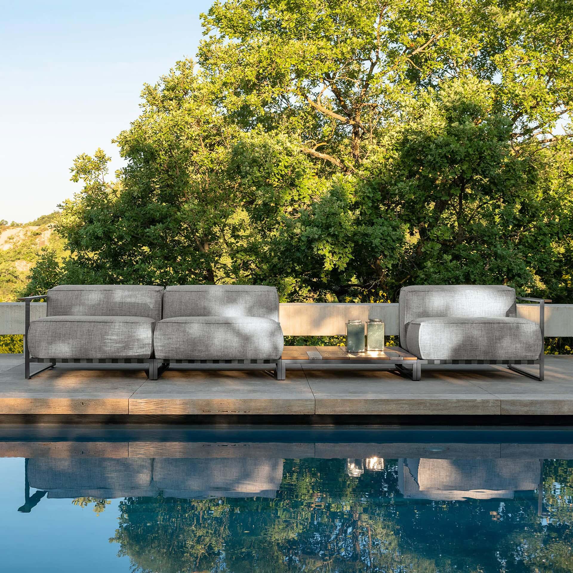 Outdoor modular sectional sofa for patio or poolside relaxation.