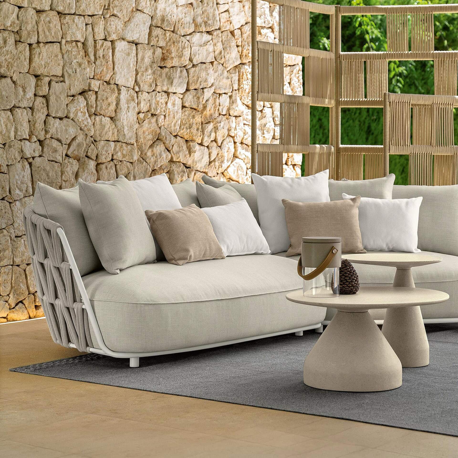 Outdoor modular sectional sofa with plush cushions and neutral tones. Perfect for stylish outdoor lo.