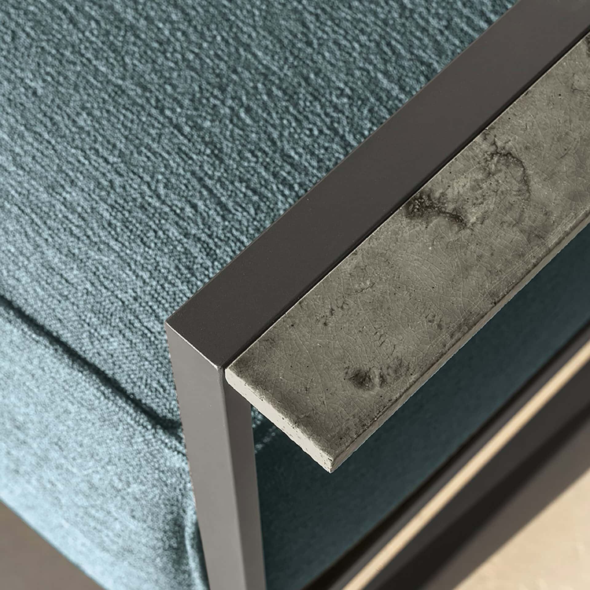 Close-up of the modern Casilda outdoor lounge chair with textured fabric and metal frame.