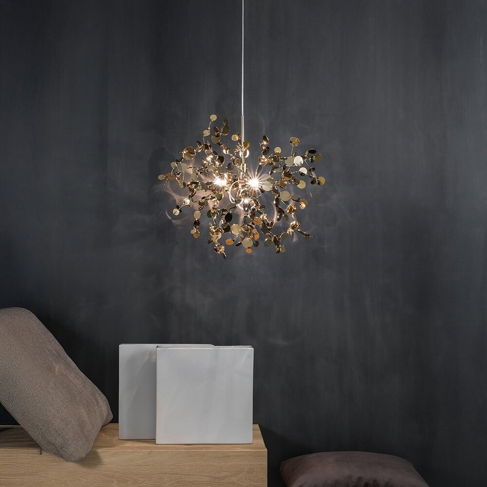 Gold leaf chandelier hanging in a contemporary living space. Perfect for stylish home lighting durin.