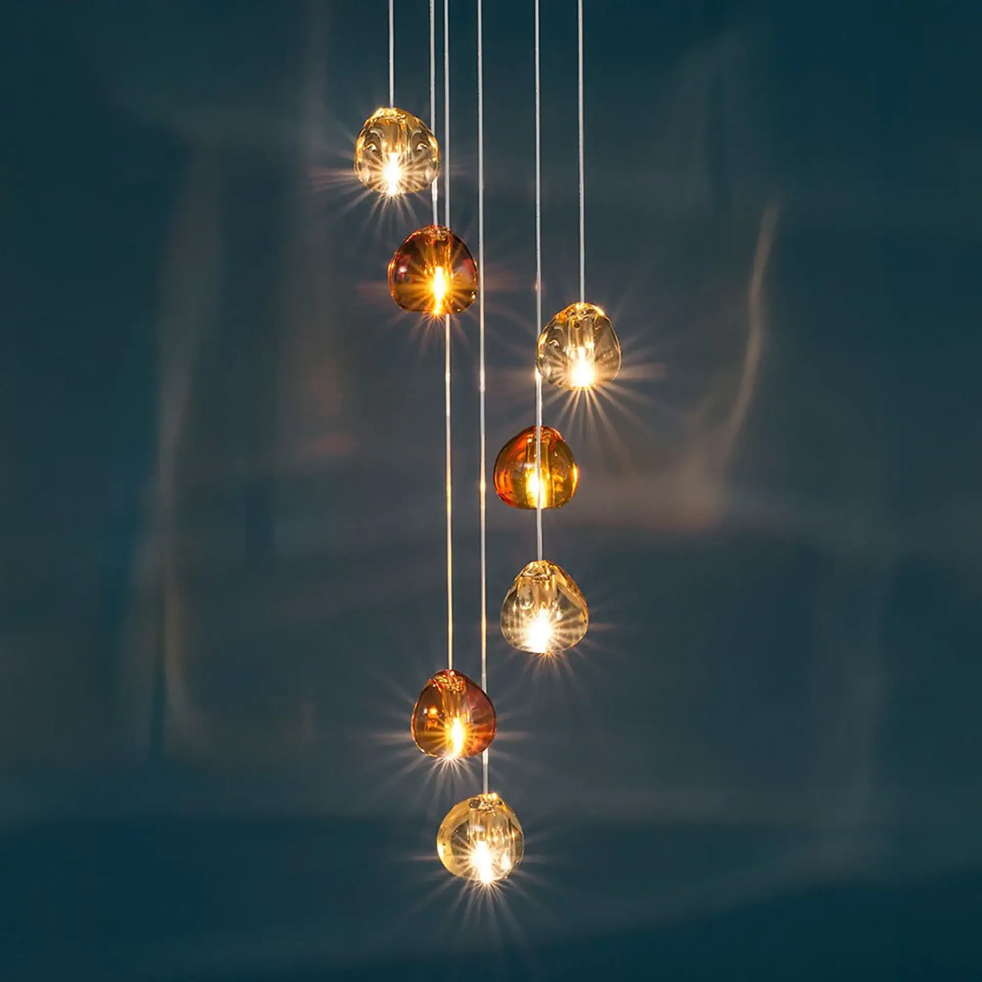 Pendant lighting, modern interior lighting, glass orb chandelier, warm LED pendant.