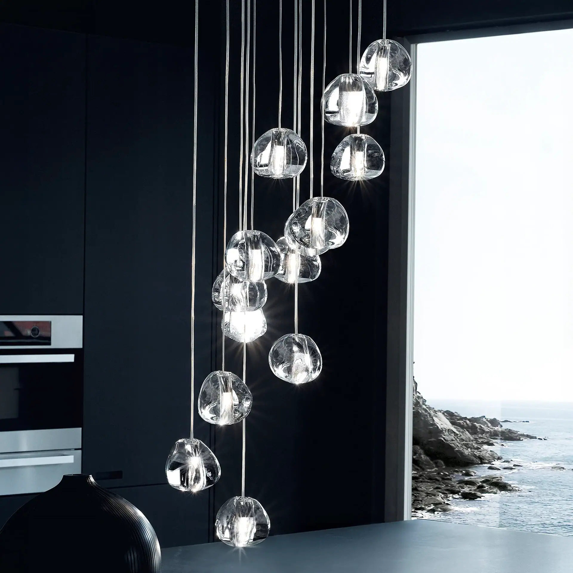 Contemporary glass pendant lighting in a modern coastal interior.