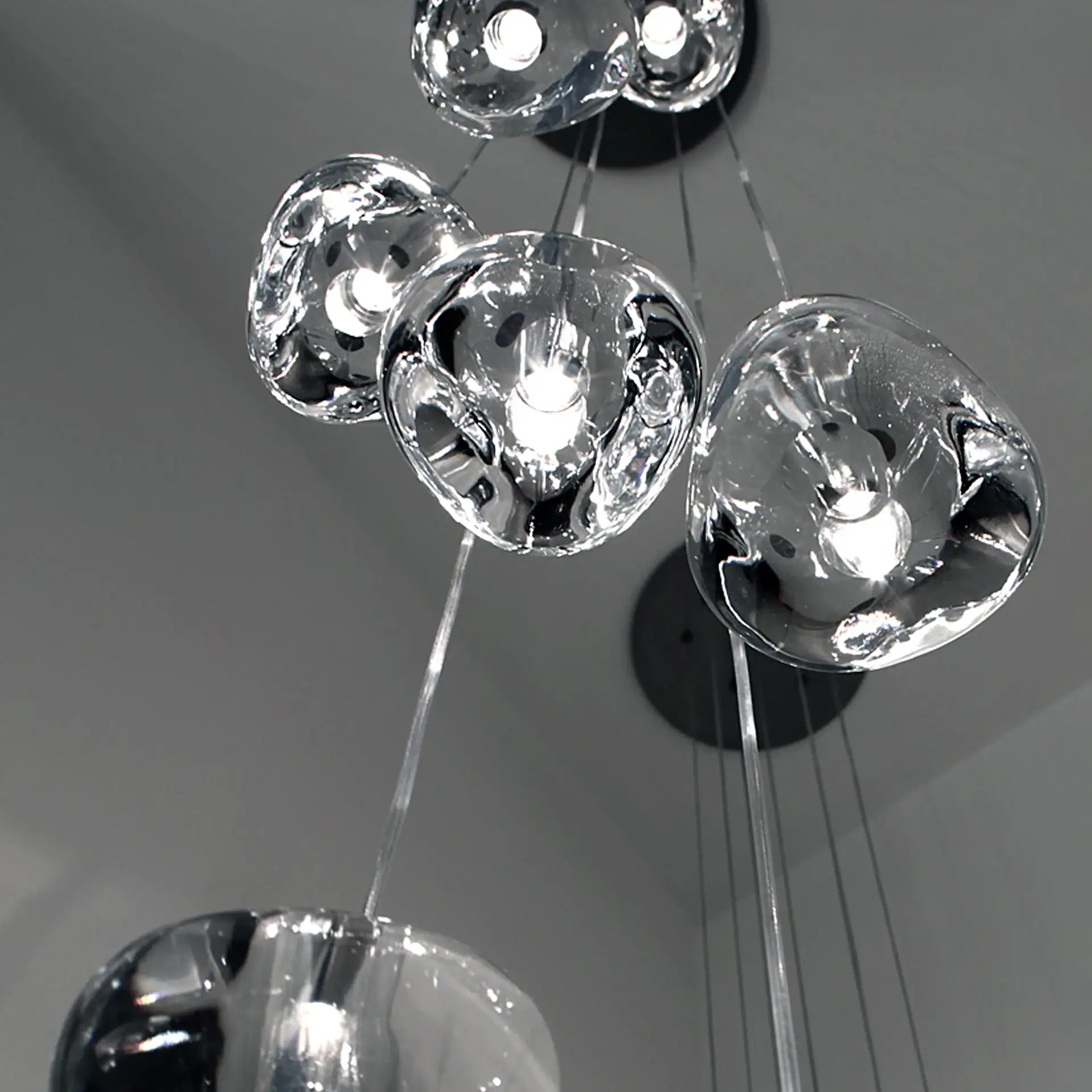 Modern glass pendant lights with sleek, contemporary design for stylish interior lighting.