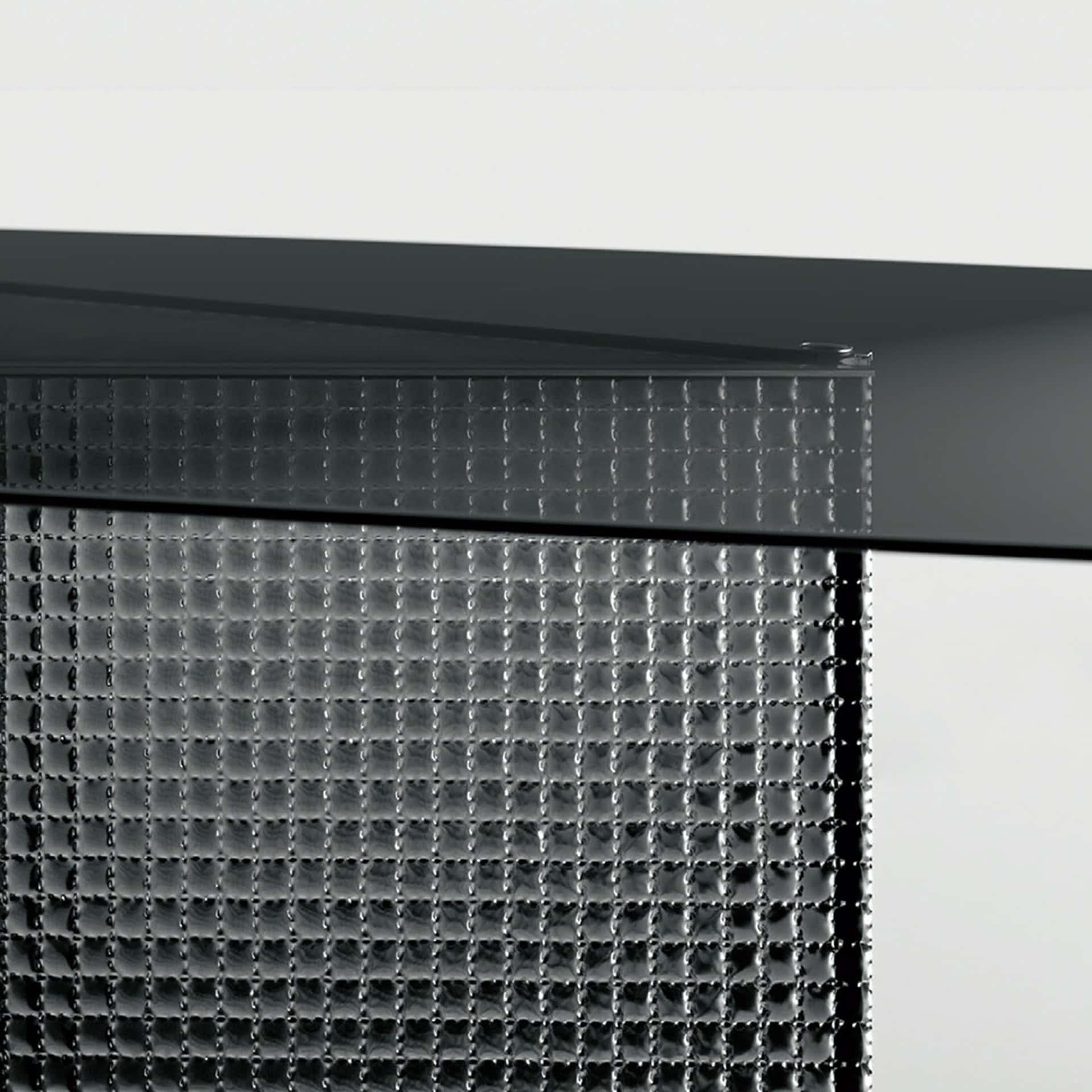 Elegant glass dining table with a sculptural bow design, perfect for contemporary dining spaces.