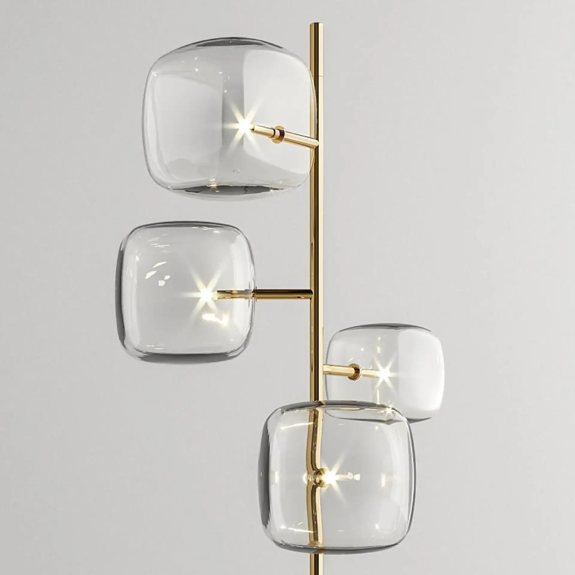 Elegant glass and gold wall sconce with four illuminated glass cubes for contemporary interior light.
