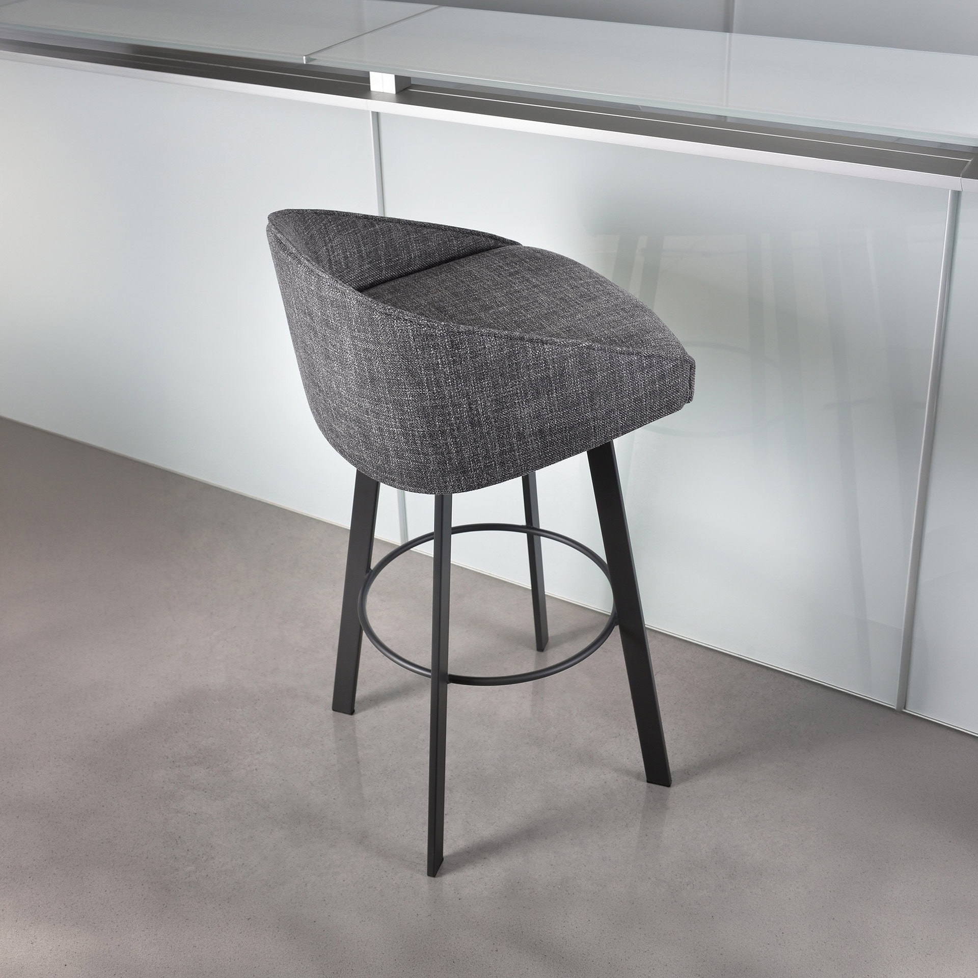 Liv Swivel Bar & Counter Stool with upholstered seat and backrest.