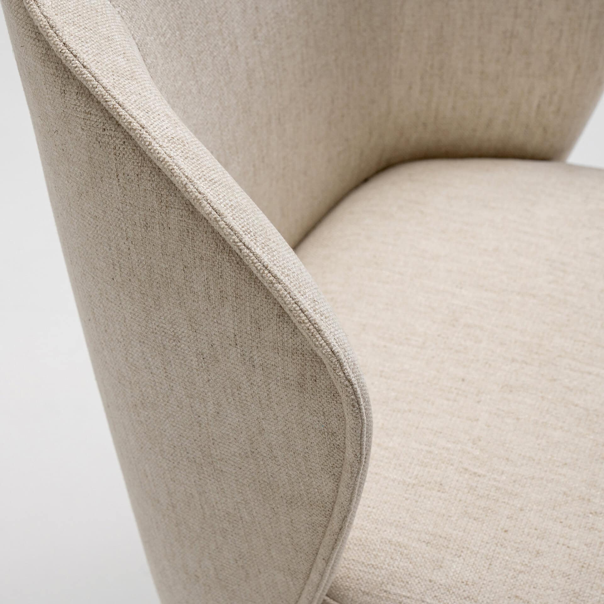 Upholstered Tessa dining armchair with elegant beige fabric and modern design. Perfect for contempor.
