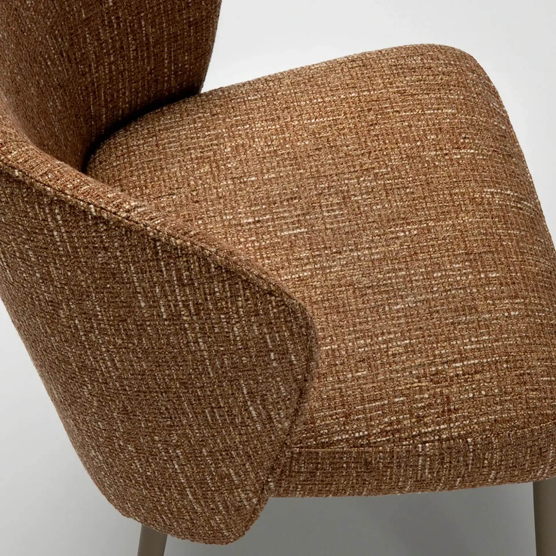 Tessa Upholstered Dining Armchair with brown fabric upholstery.