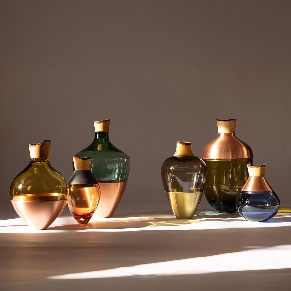 Stylish glass vases with metallic finishes, perfect for contemporary interior design.