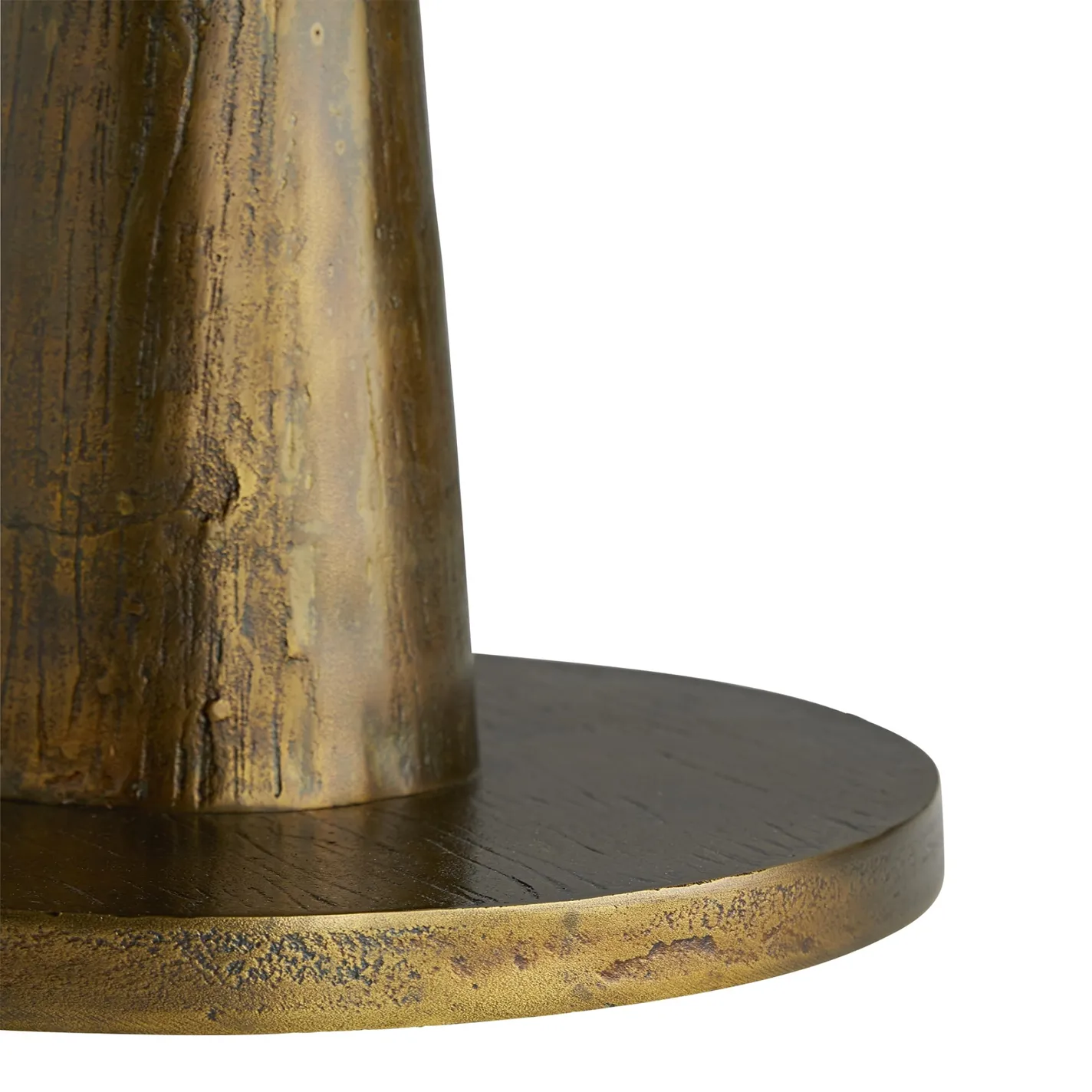 Close-up of a decorative object's base, featuring a textured golden-bronze column rising from a dark wood circular base with a matching golden-bronze edge.