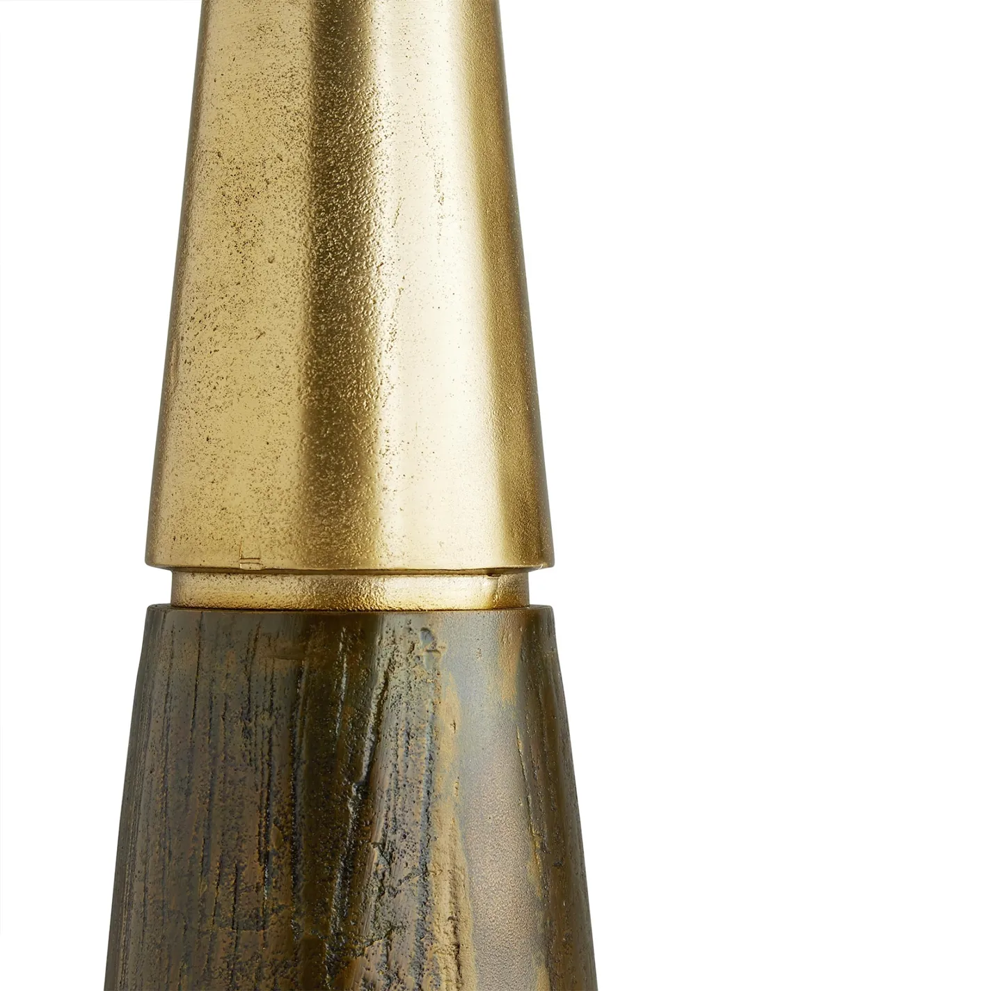 Close-up of a decorative object featuring a textured, matte gold top section and a distressed, dark brown and olive green, wood-like base, against a white background.