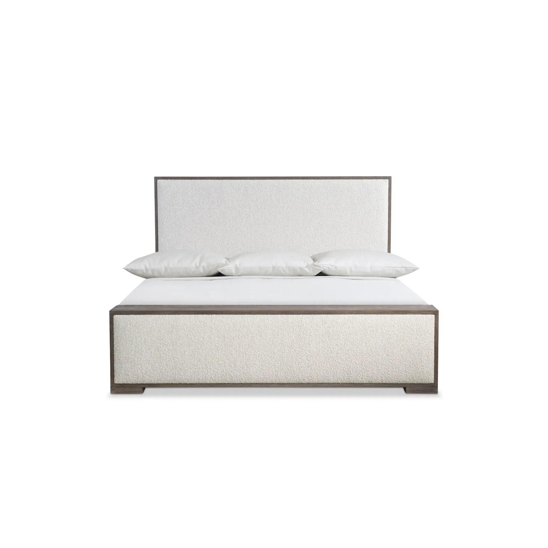 A modern bed with a textured off-white upholstered headboard and frame, accented with dark brown wood. Three white pillows rest on a white sheet.