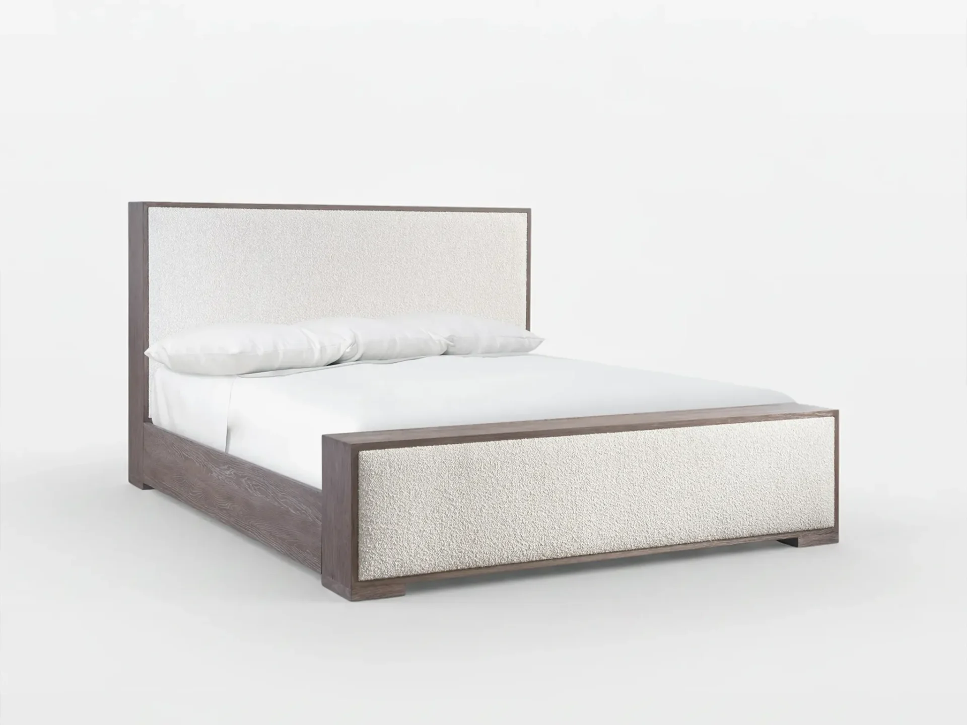 A modern bed with a dark wood frame and cream textured fabric panels on the headboard and footboard, set against a white background. The bed has white sheets and two white pillows.