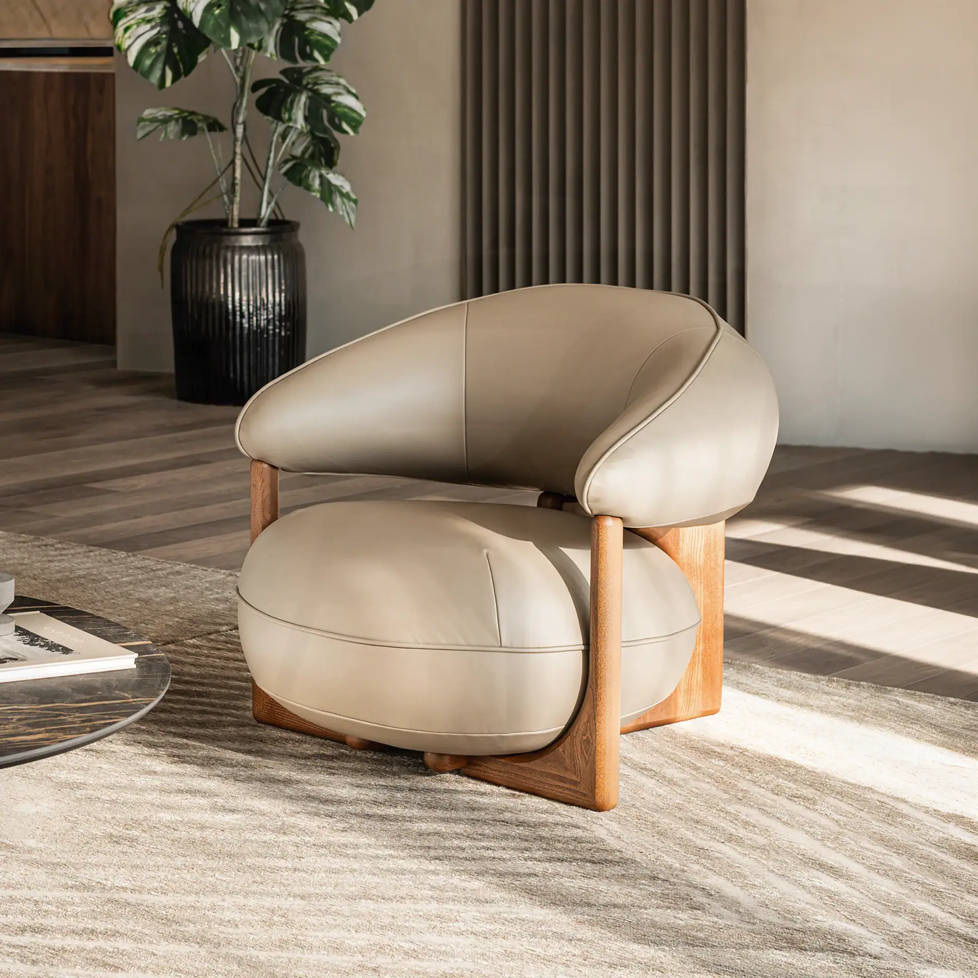 Modern beige lounge armchair with wooden frame in stylish living room.
