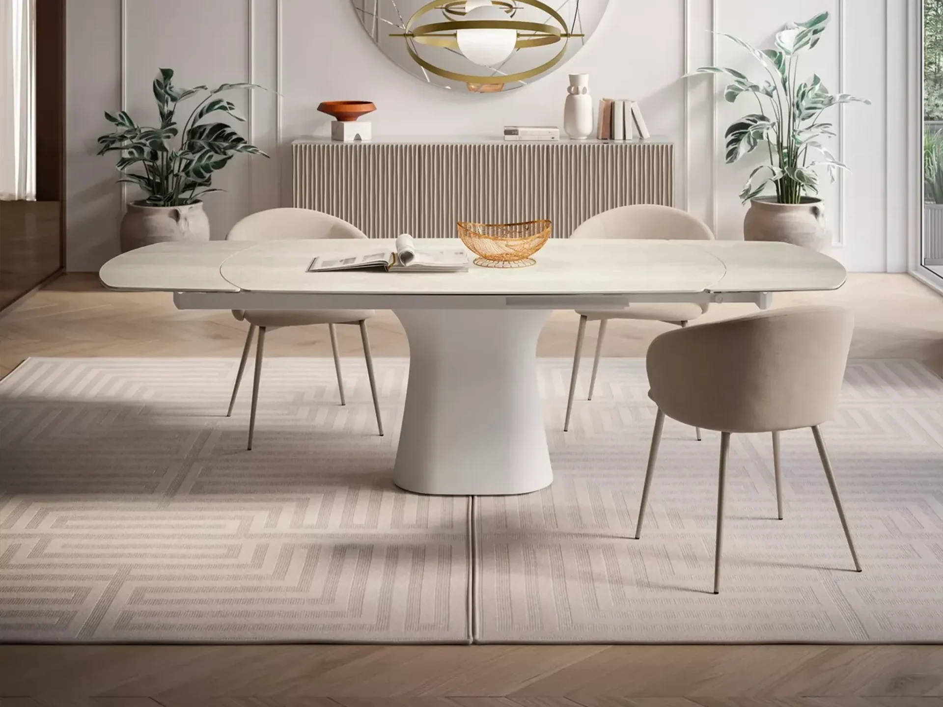A modern oval white table with beige mesh chairs in a room with a dark gray wall, black marble fireplace, and herringbone floor.