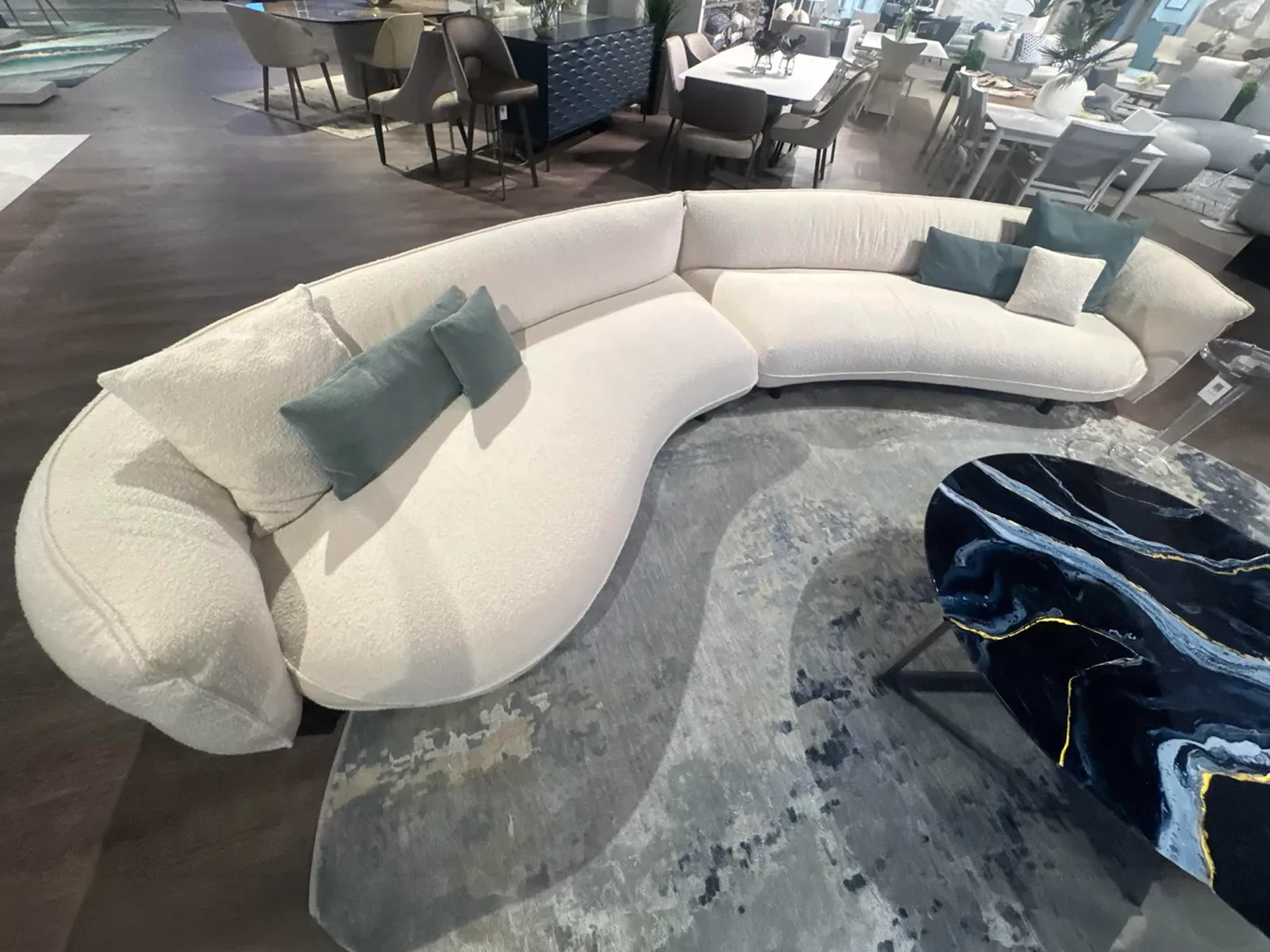 Modern Cierre Seed sectional sofa with neutral upholstery and accent pillows.