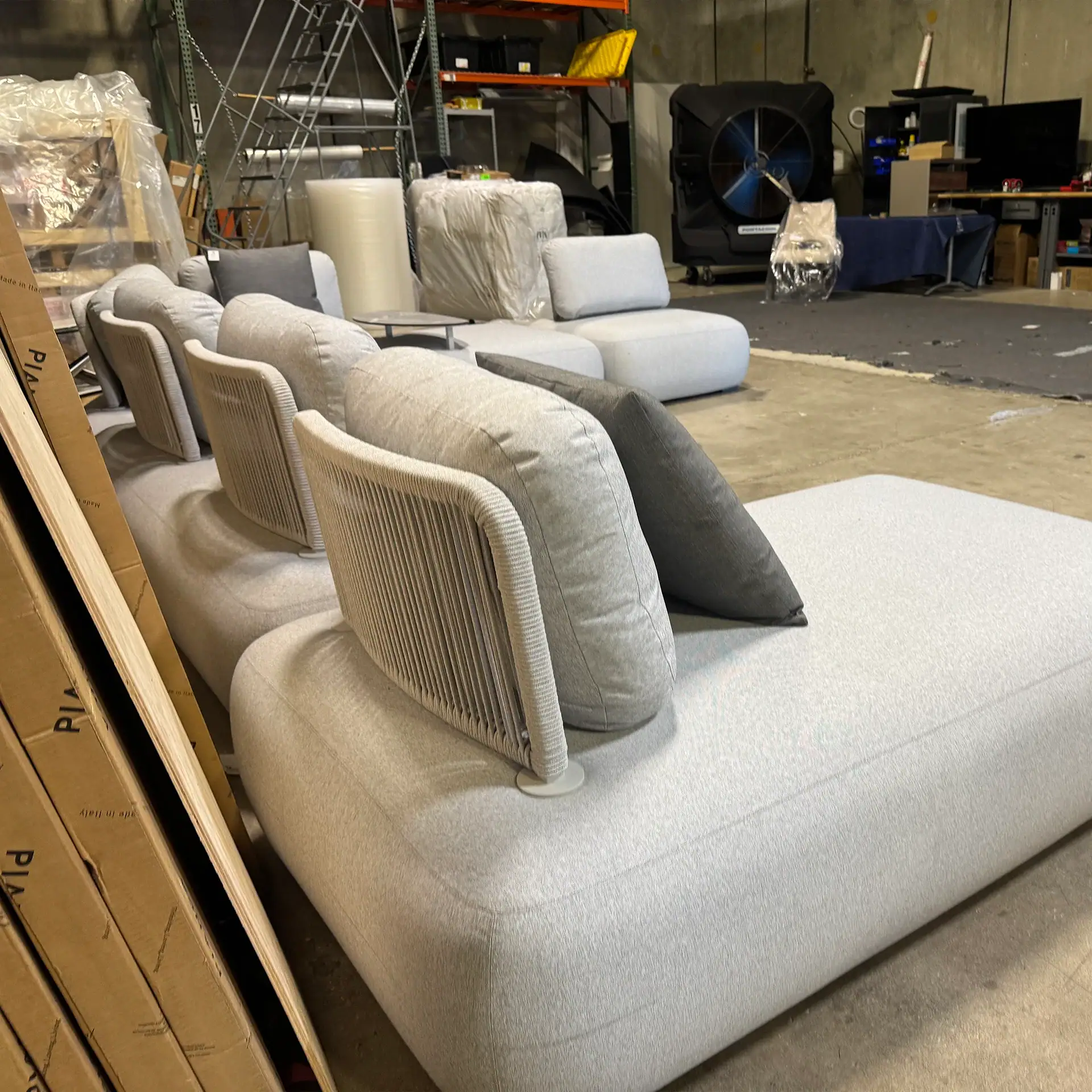 Modern outdoor sectional with plush cushions and neutral tones for stylish outdoor living.
