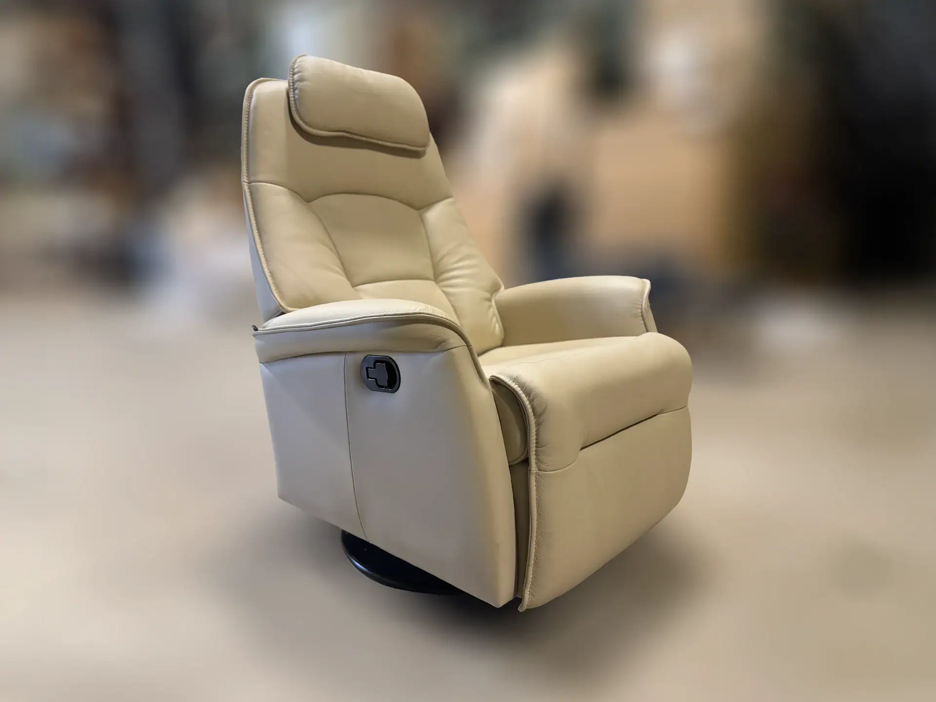 Comfortable beige power recliner chair with plush cushioning and adjustable headrest.