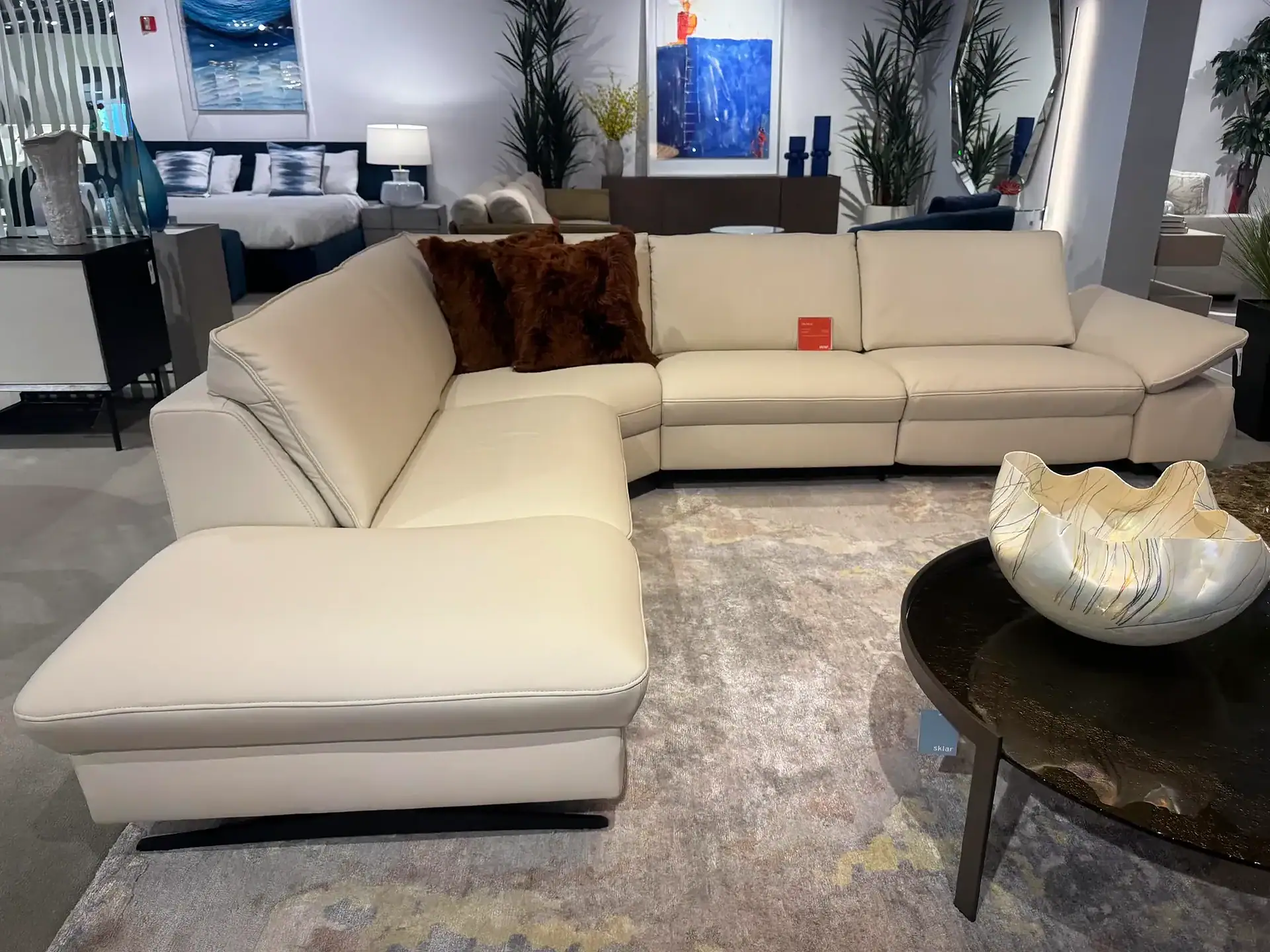 Elegant Himolla Alvaro sectional sofa in a modern showroom setting.
