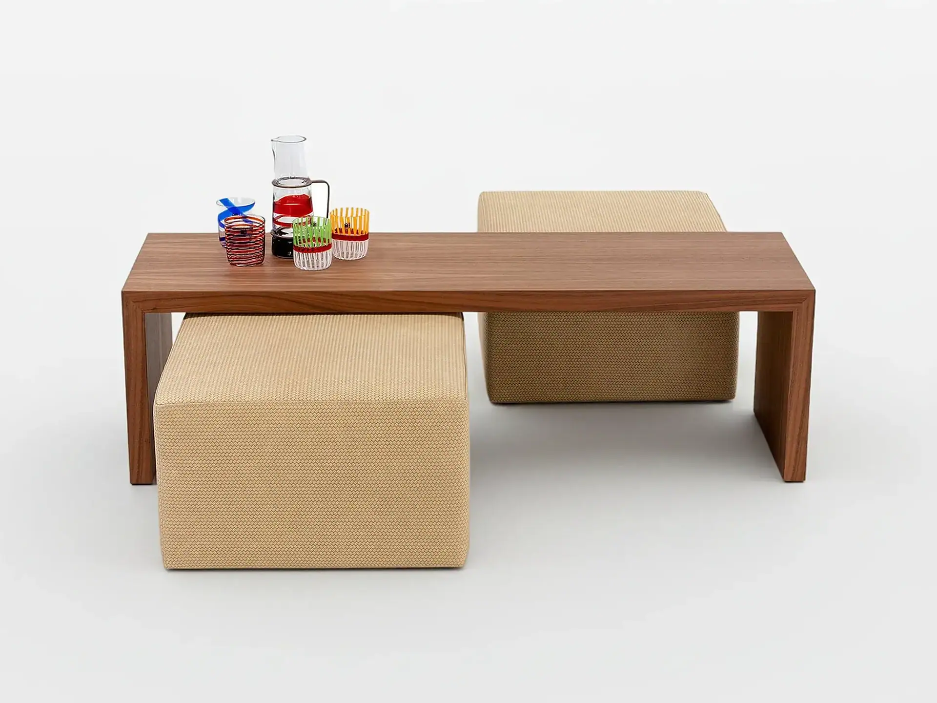 Stylish wooden table with beige poufs, perfect for contemporary living spaces.