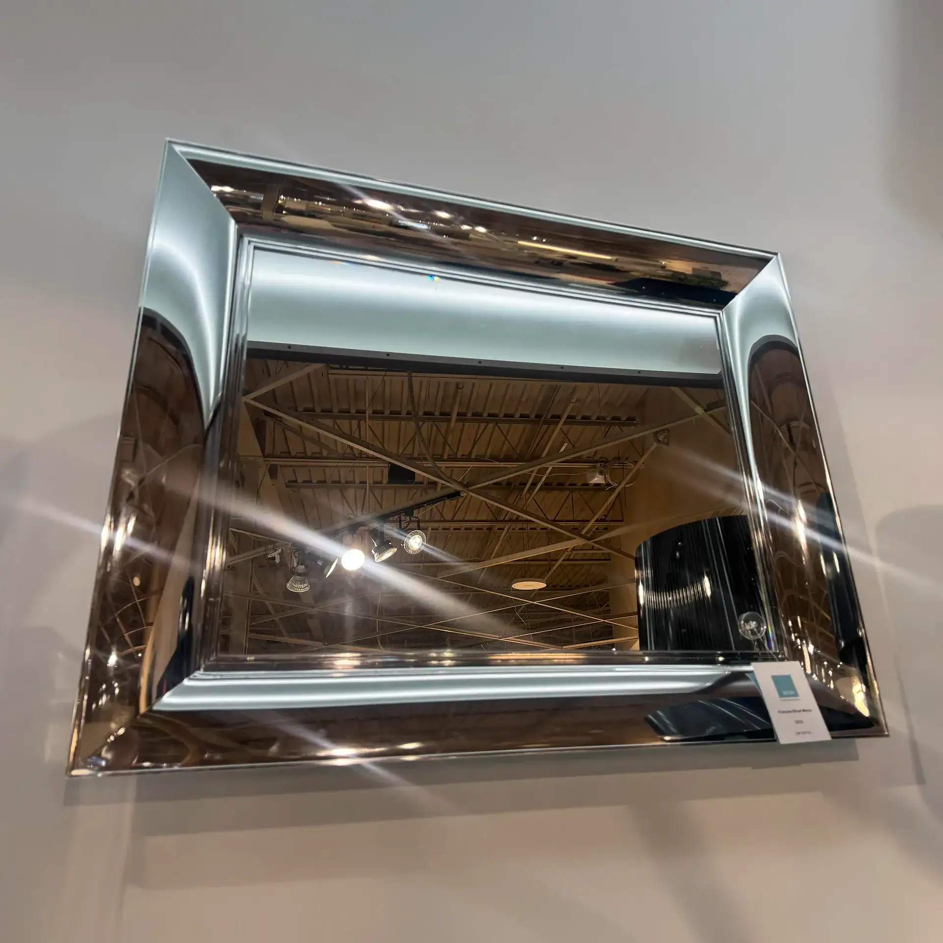 Elegant small mirror with a sleek, modern design by Kartell.