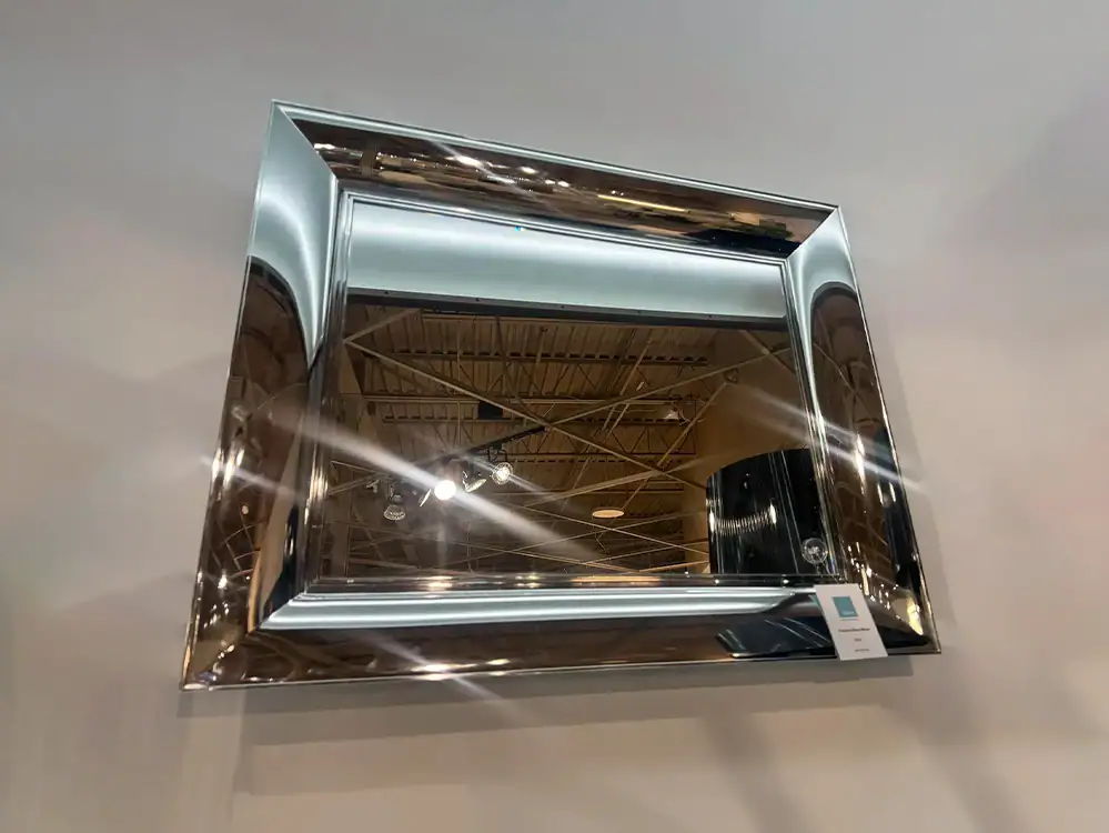 Small Kartell François Ghost Mirror with reflective chrome finish.