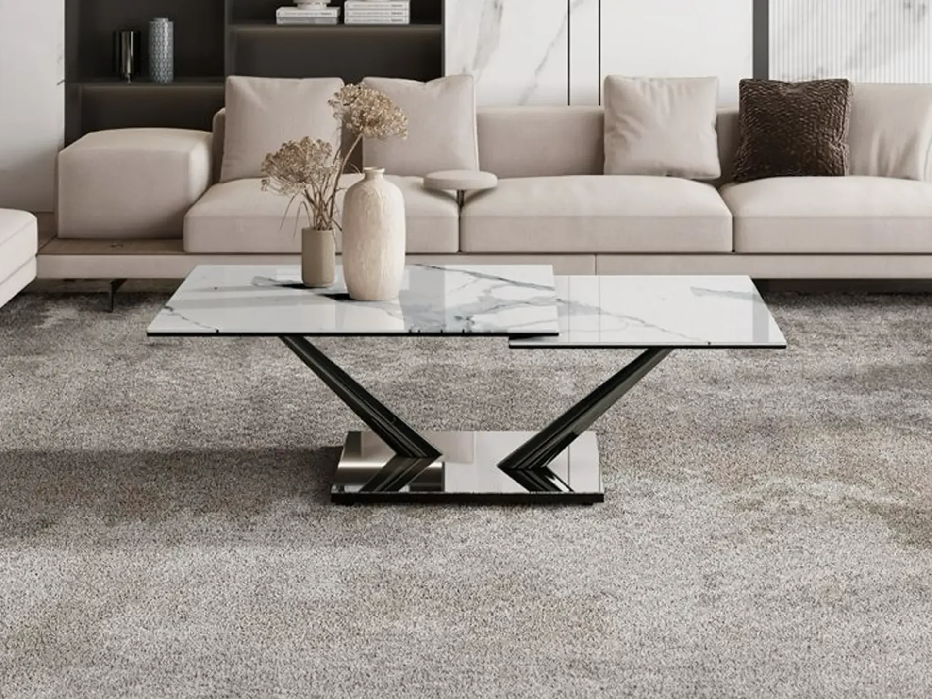 A modern living room with a white marble coffee table, a light beige sofa, and a dark shelving unit on a gray carpet.