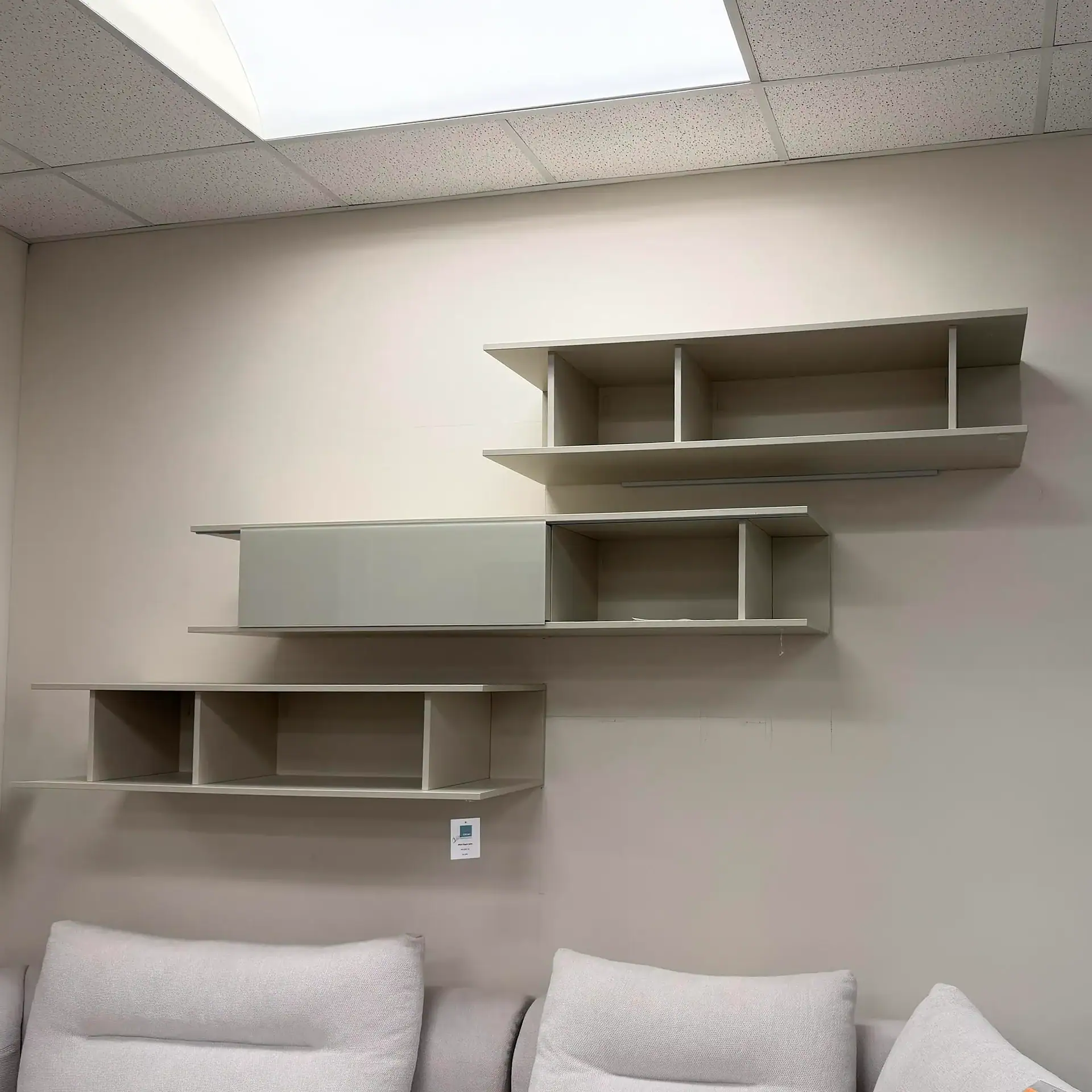 Hanging bookcase with multiple compartments, modern design, ideal for stylish storage solutions.