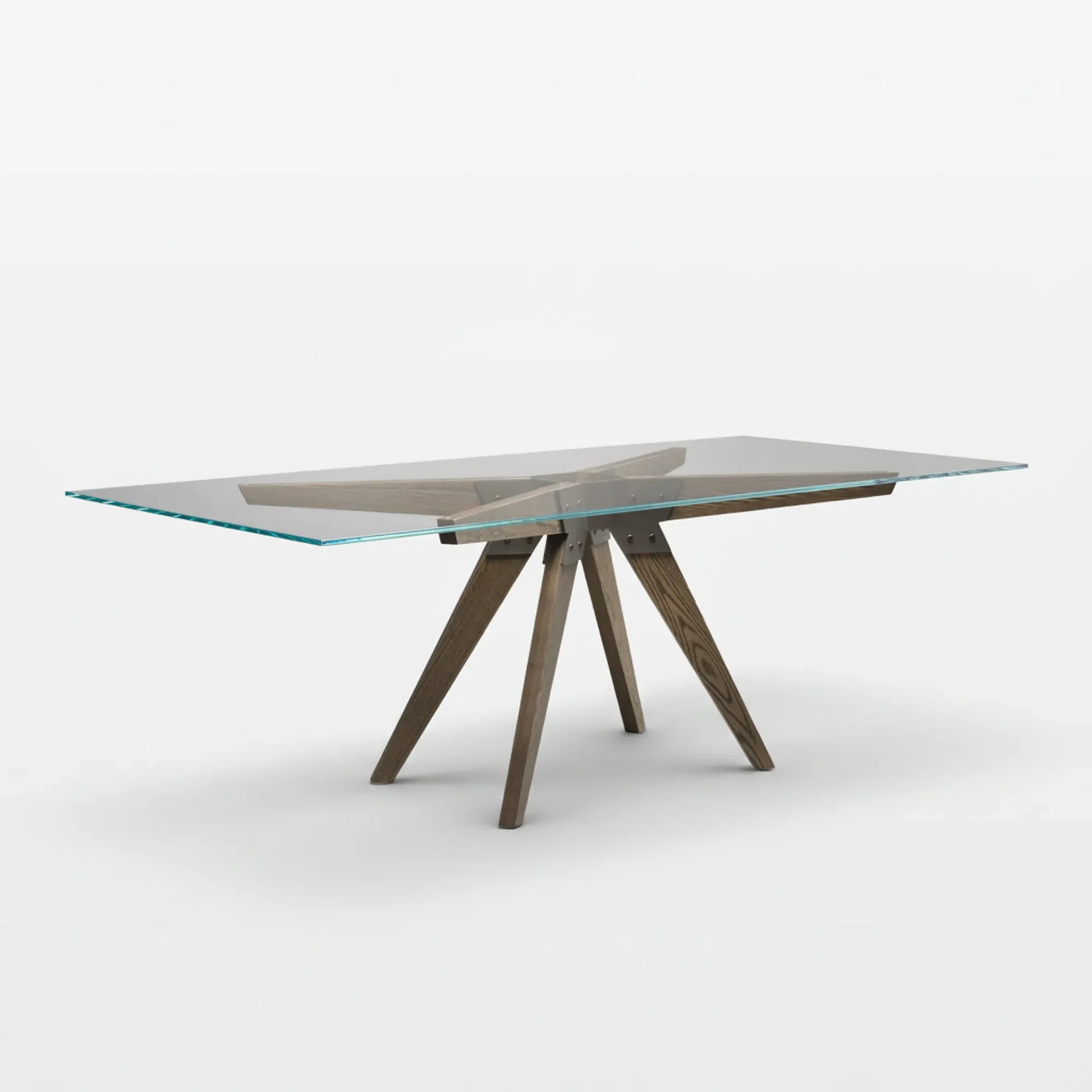 A modern dining table with a clear rectangular glass top and a dark wooden base with splayed legs and metal connections, on a white background.