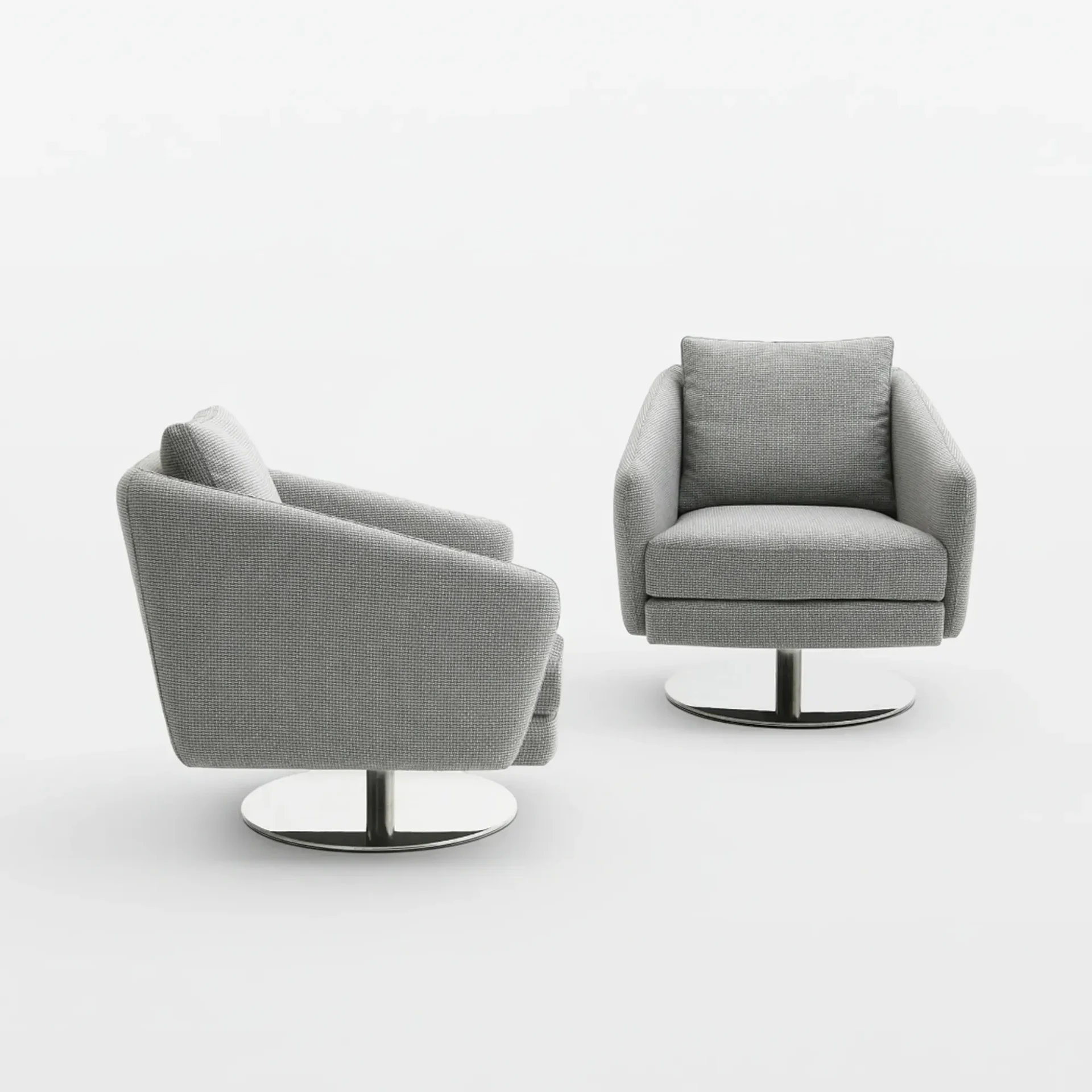 Two grey fabric swivel armchairs with polished chrome bases on a white background. One faces forward, the other is angled.