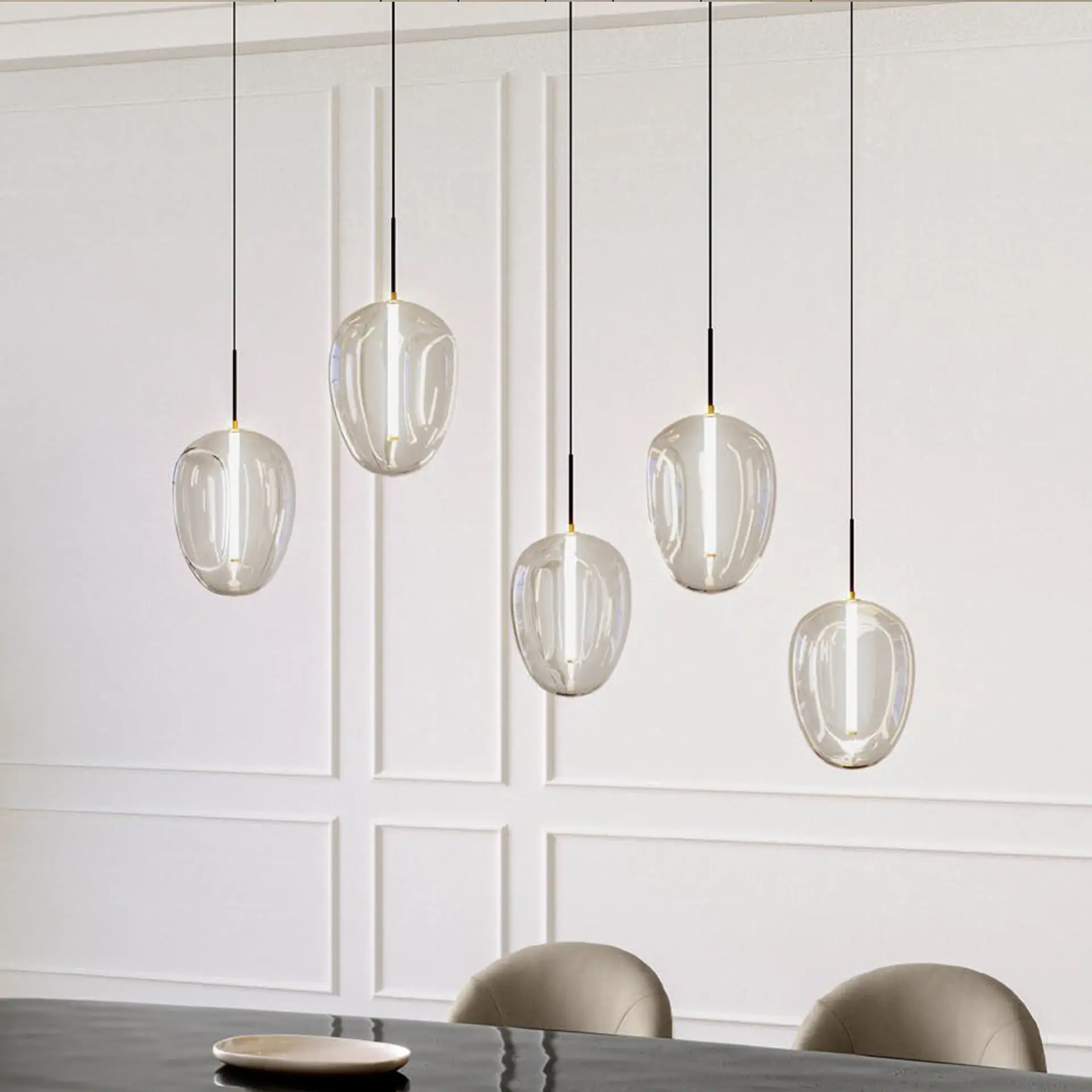 Elegant Fos glass pendant light hanging in a contemporary interior setting.
