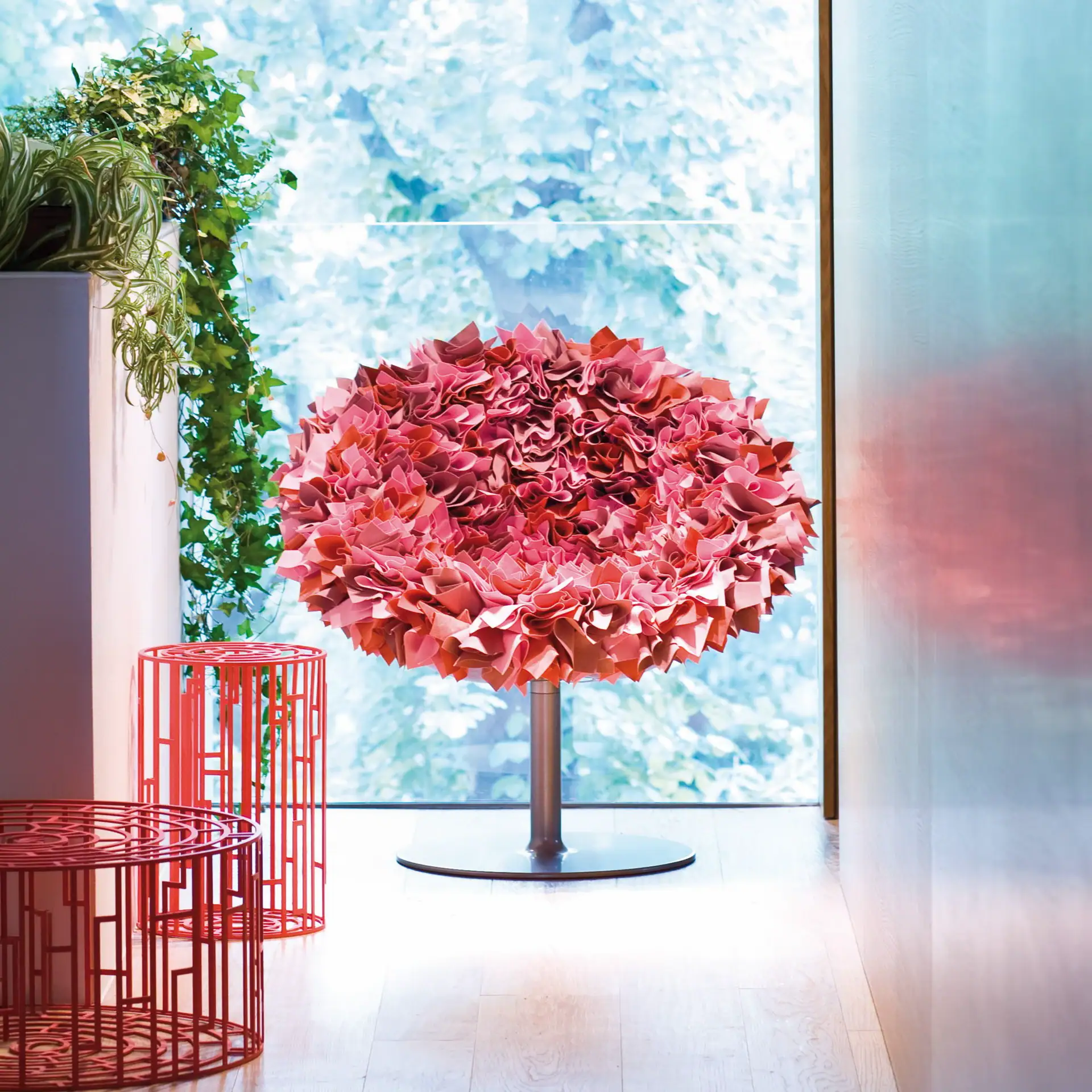 Elegant pink floral-inspired swivel armchair for modern living spaces.