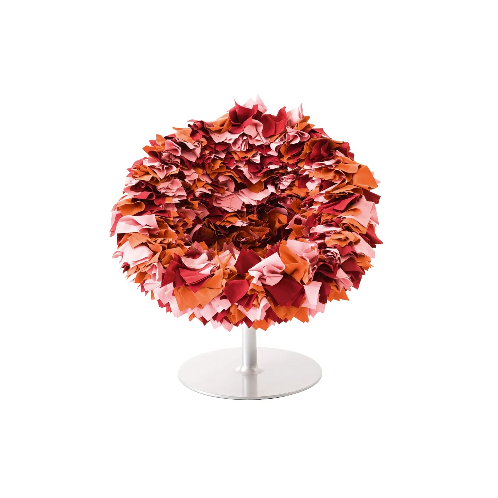 A spherical chair made of ruffled pink, orange, and red fabric scraps on a silver pedestal base, against a white background.