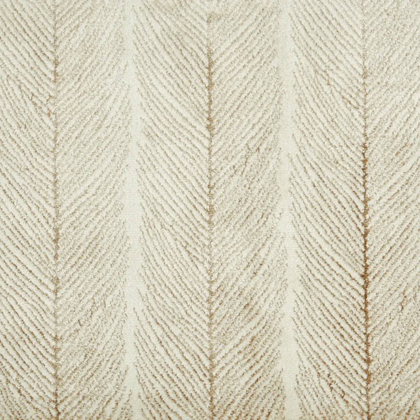 Close-up of a cream and beige textured fabric or carpet with a vertical chevron pattern.