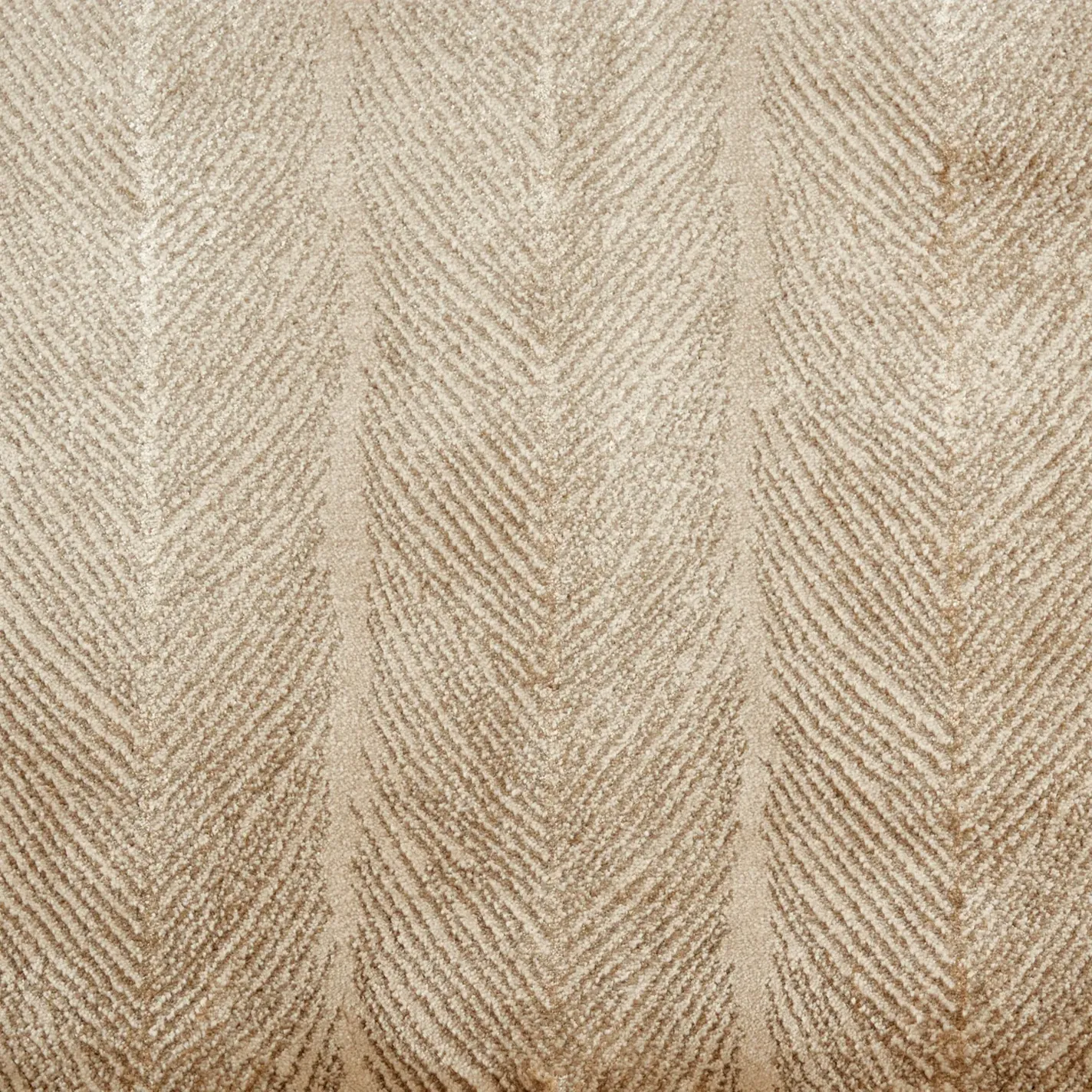 Close-up of a light beige textured fabric or carpet featuring a vertical herringbone pattern.