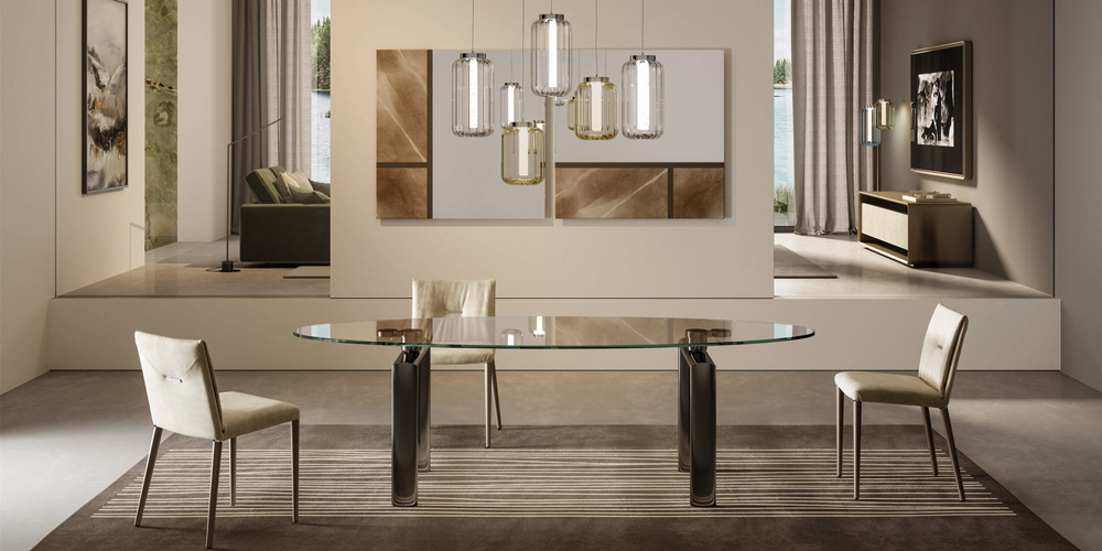 Modern glass dining table with sleek white chairs in a contemporary dining room setting.