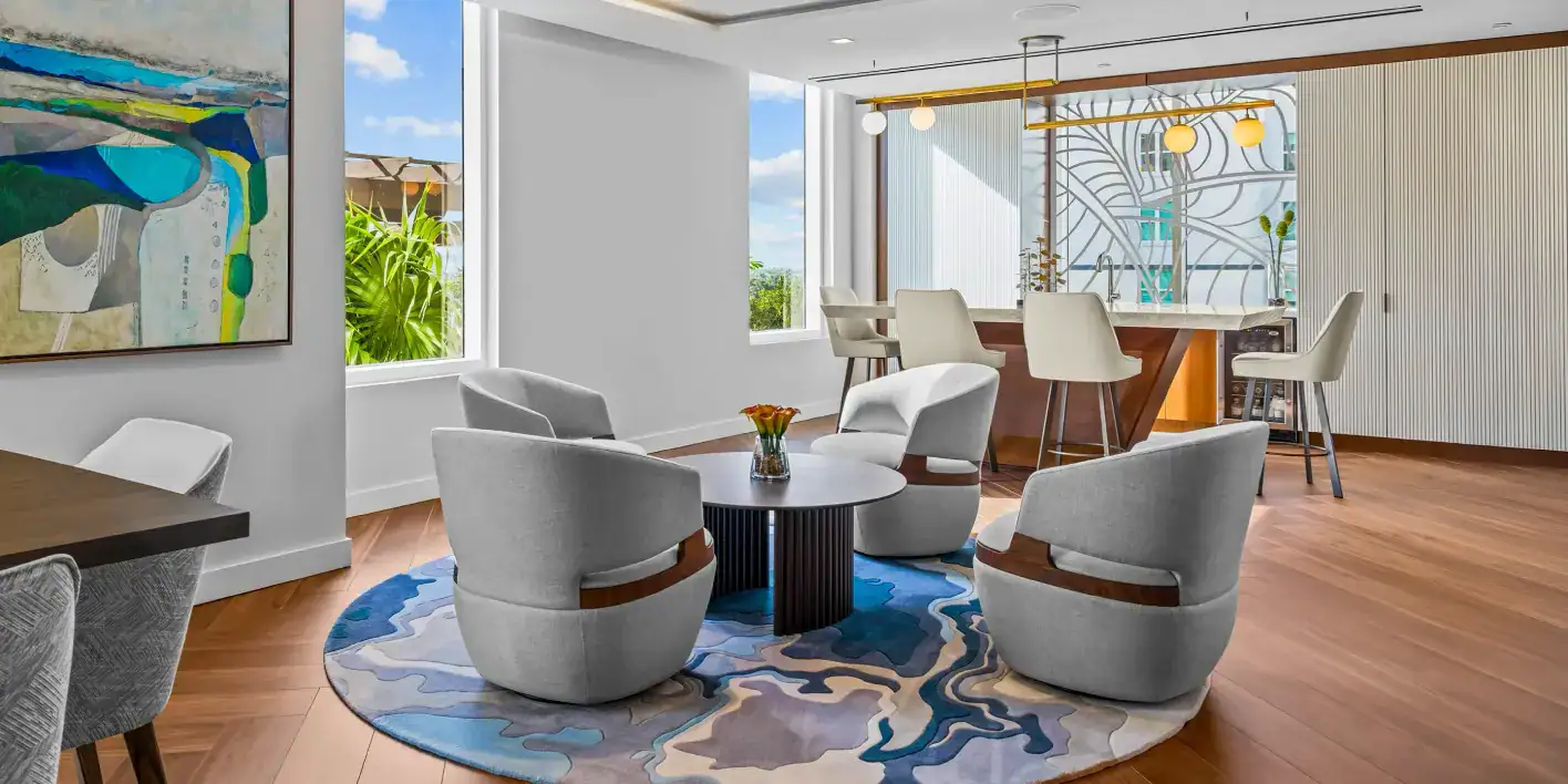 Elegant living room featuring contemporary furniture, large windows, and stylish decor for a comfort.