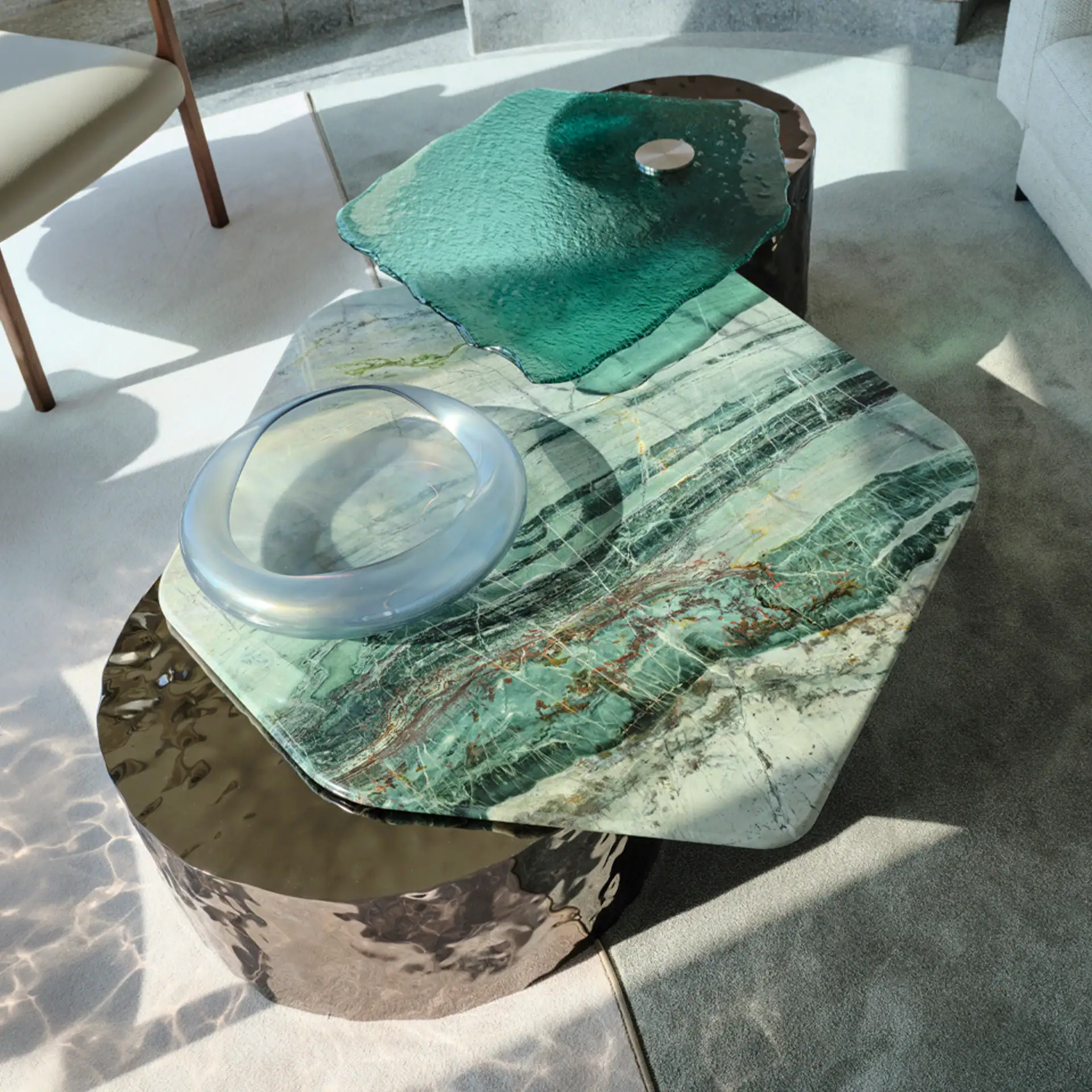 Elegant marble and glass coffee table with unique organic shapes.