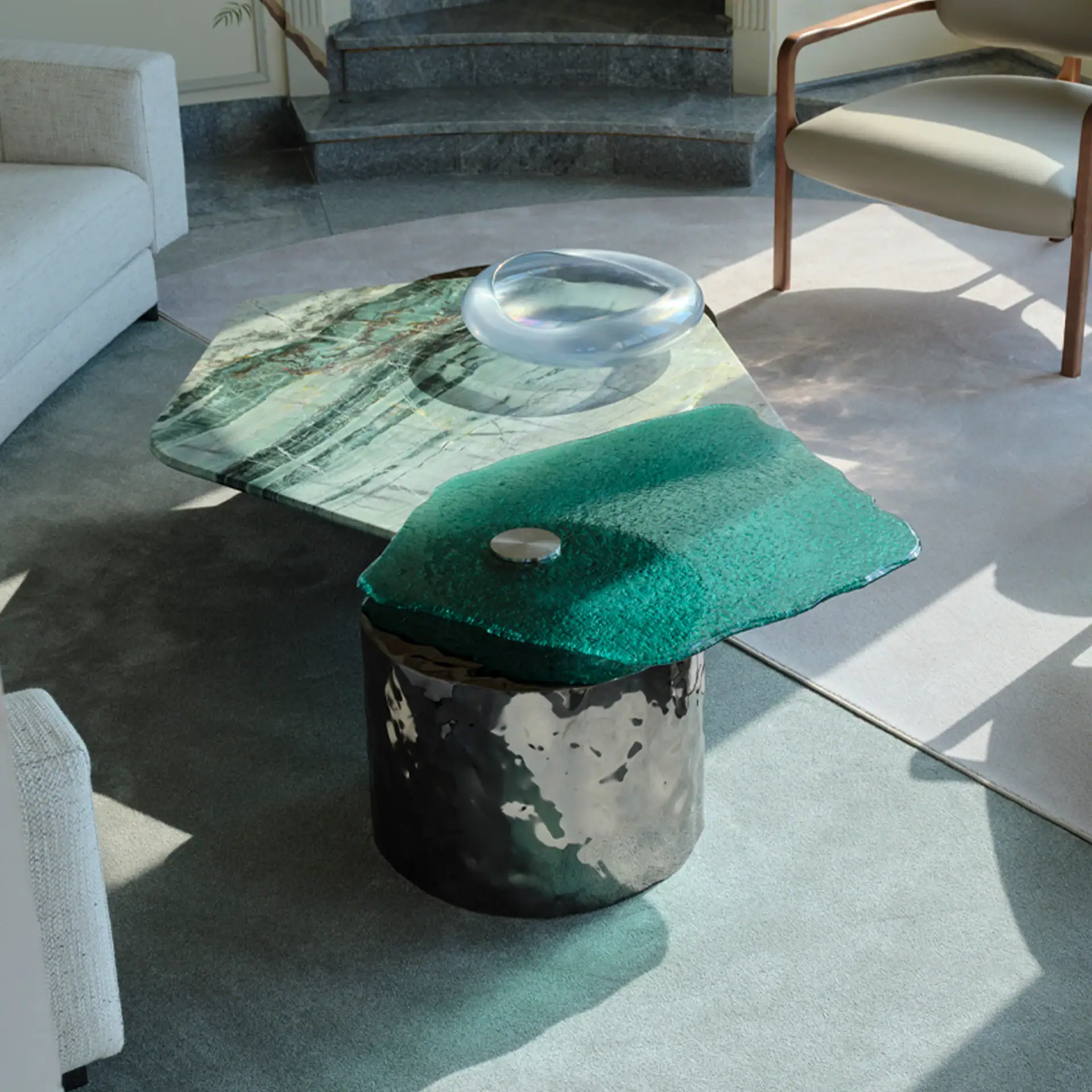 Modern Materia coffee table with mixed materials in stylish living room setting.