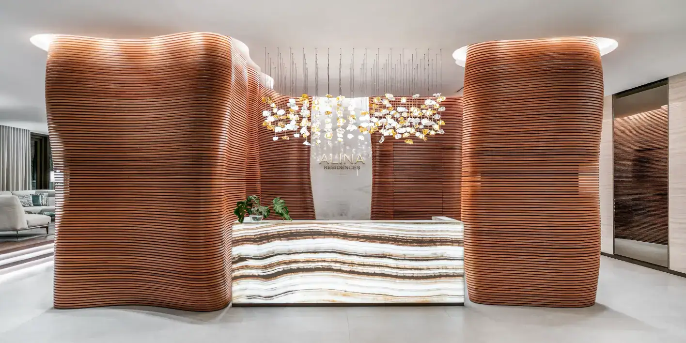 Elegant wooden interior with curved partitions and contemporary lighting fixtures.