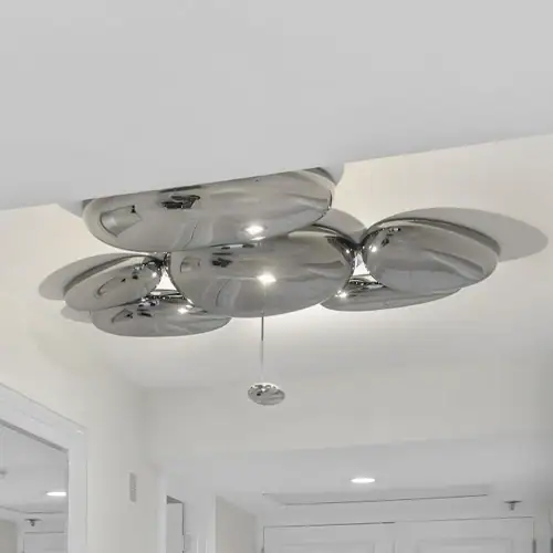 Contemporary chrome ceiling light fixture with multiple reflective globes.