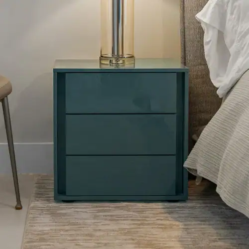Blue nightstand with three spacious drawers for bedroom storage.