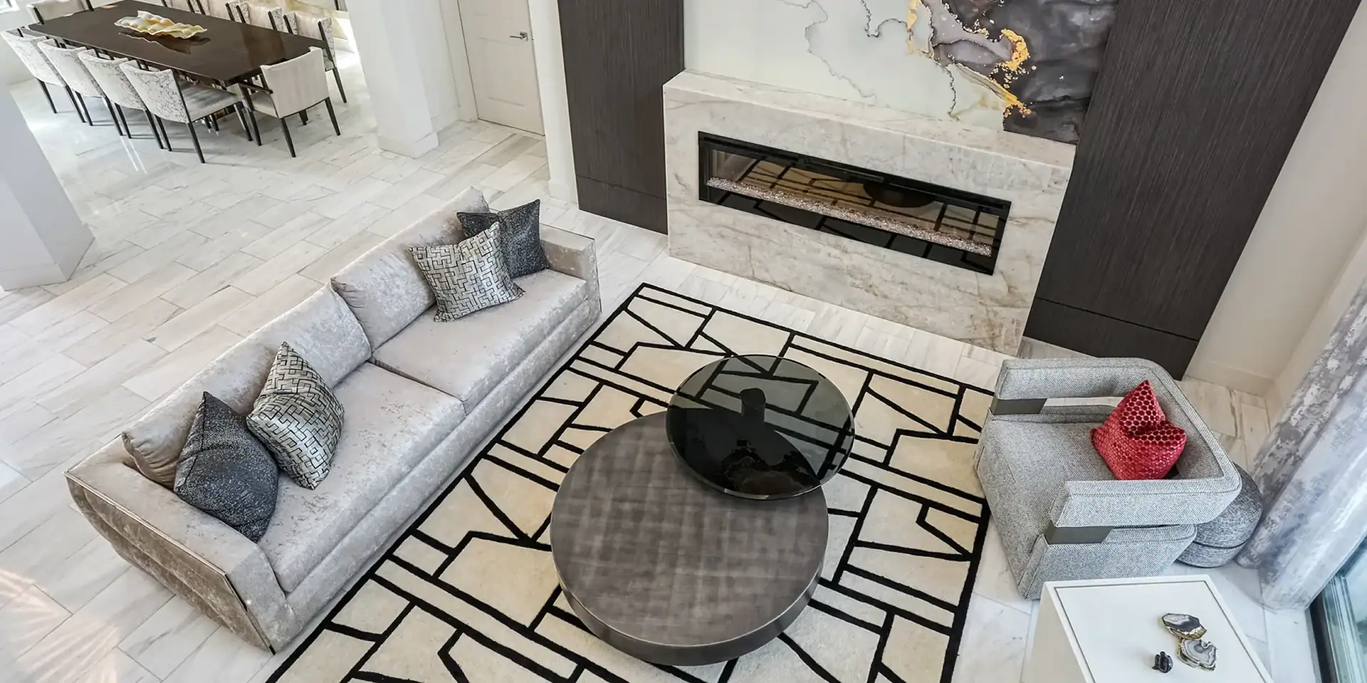 Modern living room with contemporary sofa and sleek fireplace design.