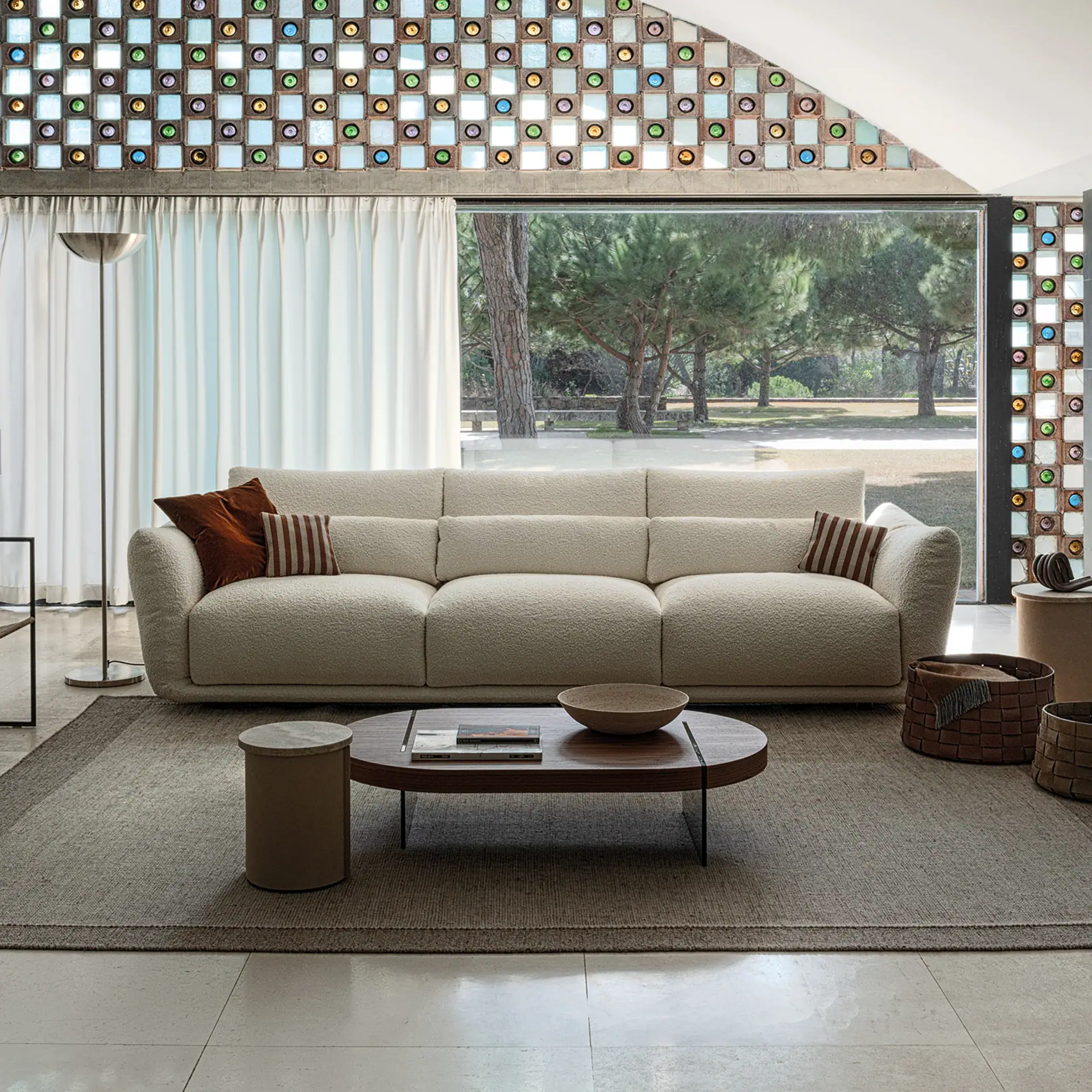 Elegant Clift sectional sofa with plush cushions in a contemporary living space.