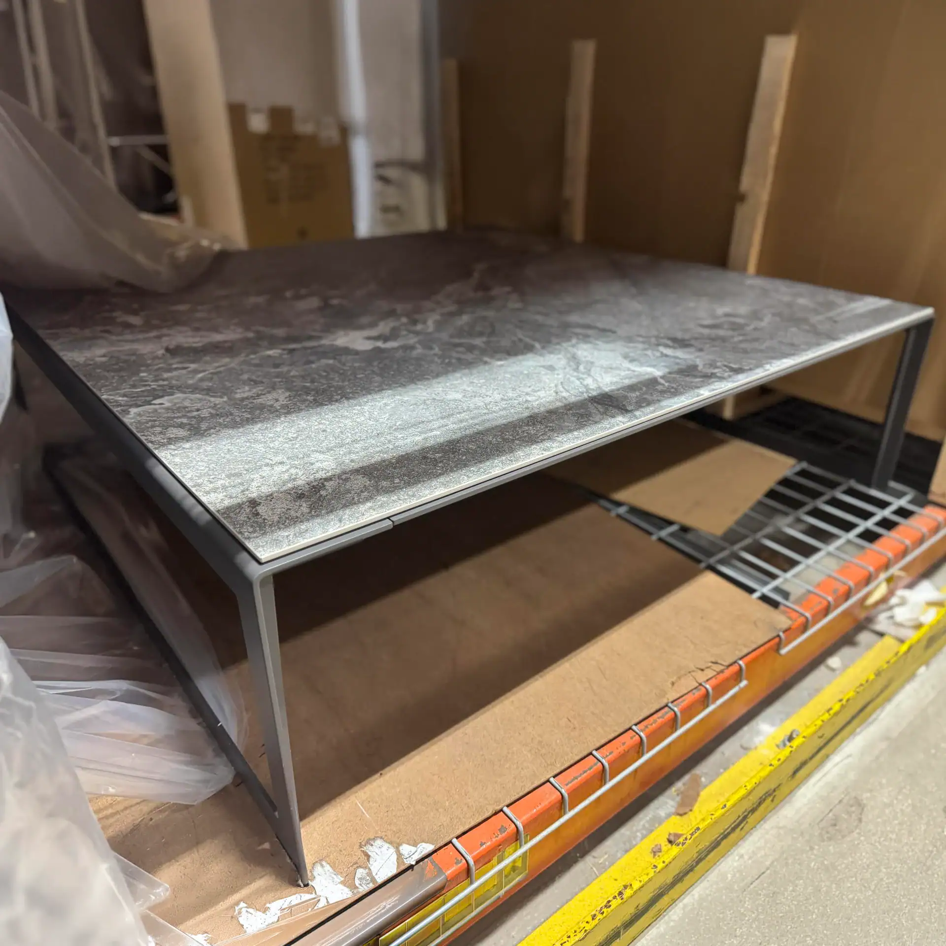 Modern Cattelan Italia Kitano D coffee table with marble top and metal frame.