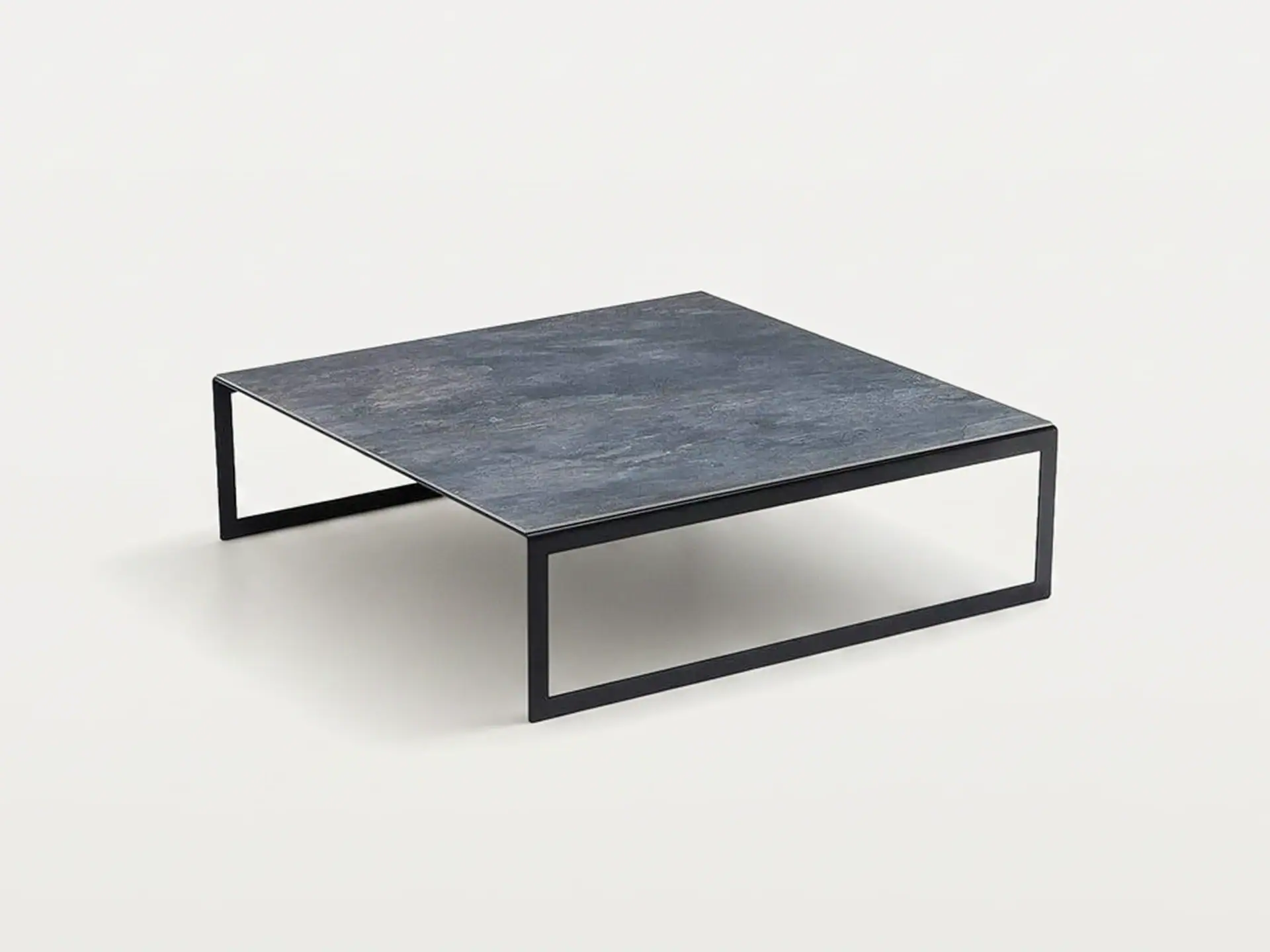 Modern black metal and stone coffee table for contemporary living rooms.