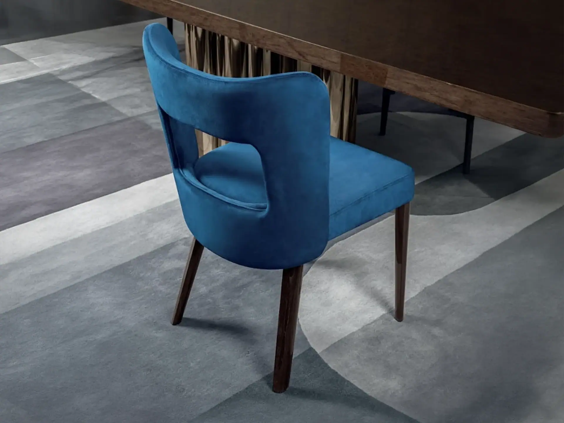 Elegant blue upholstered dining chair with wooden legs, perfect for contemporary dining rooms.