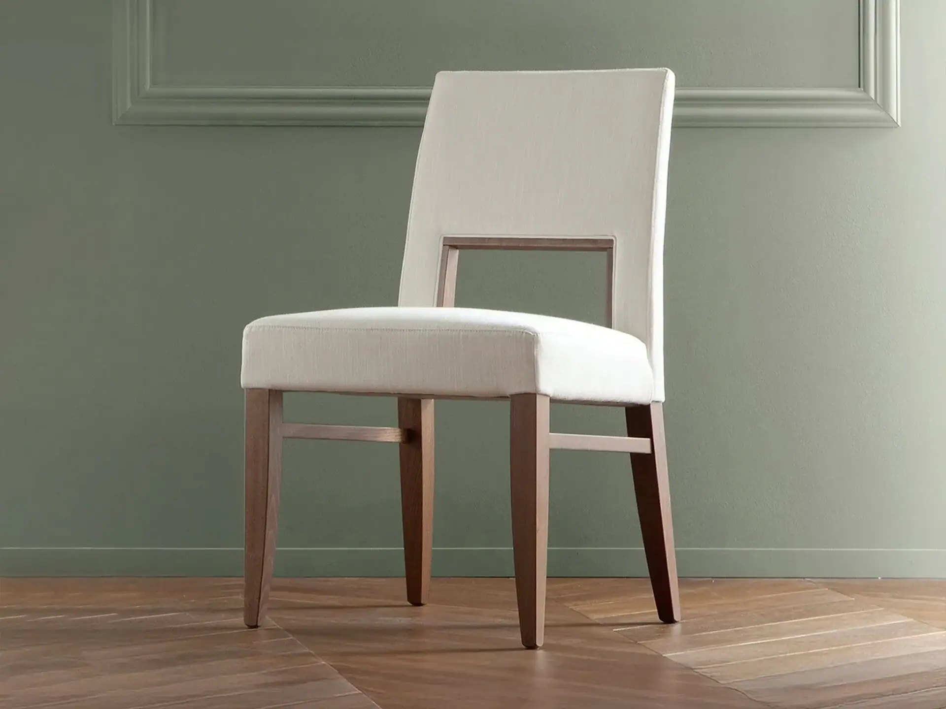 Modern dining chair with upholstered seat and wooden frame.