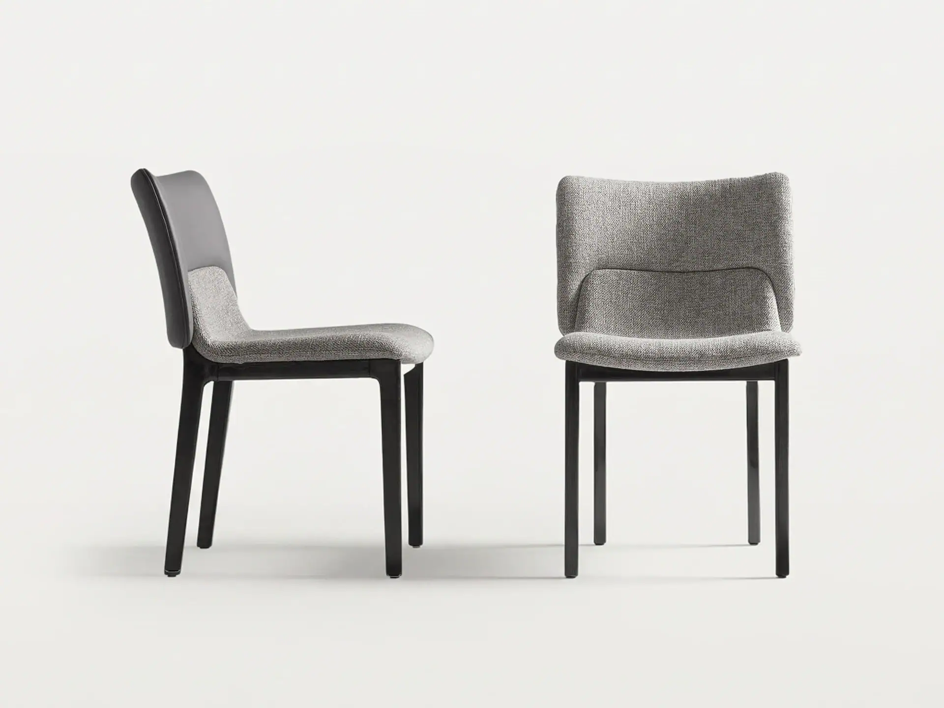 Nora side dining chair by Costantini Pietro, upholstered in grey fabric with black wooden legs.