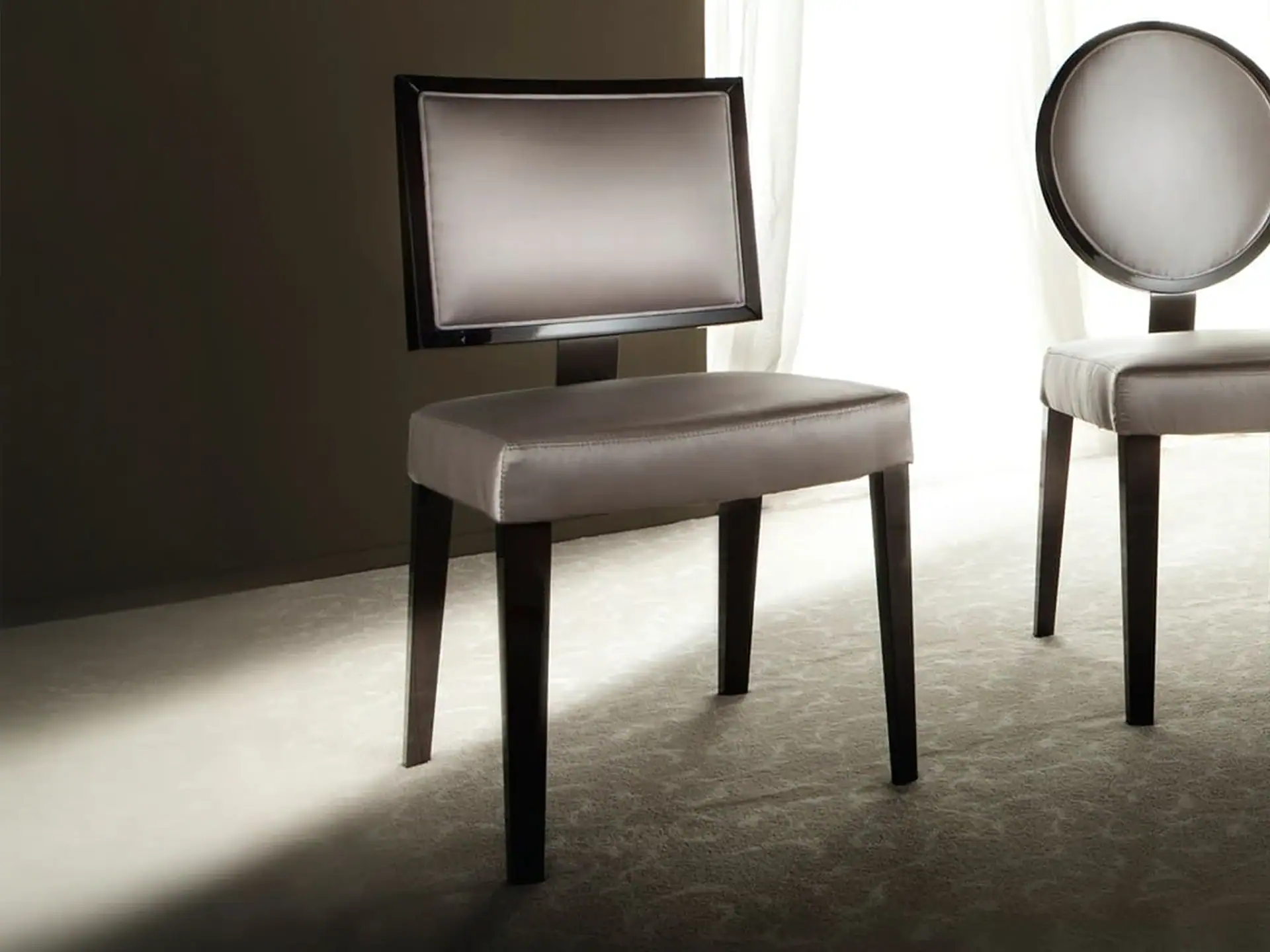 Elegant modern dining chairs with dark wooden legs and upholstered seats for stylish dining rooms.